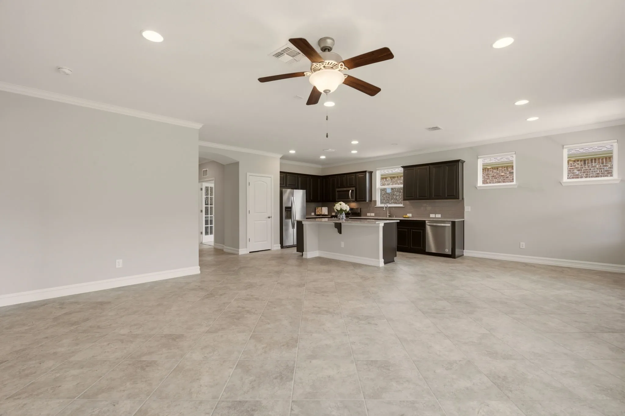 Versatile family room with easy care ceramic tile.