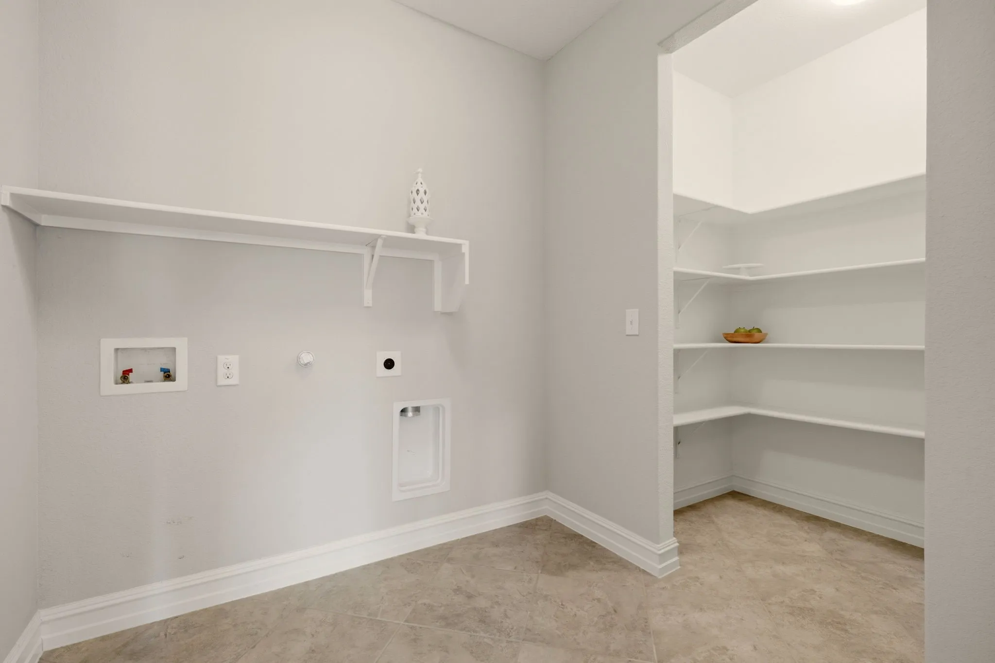 Oversized laundry room and second pantry.