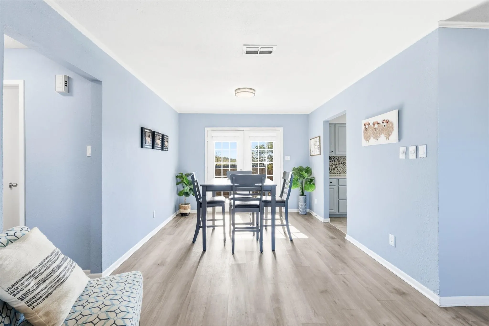 Dining room featuring light wood finished floors and baseboards