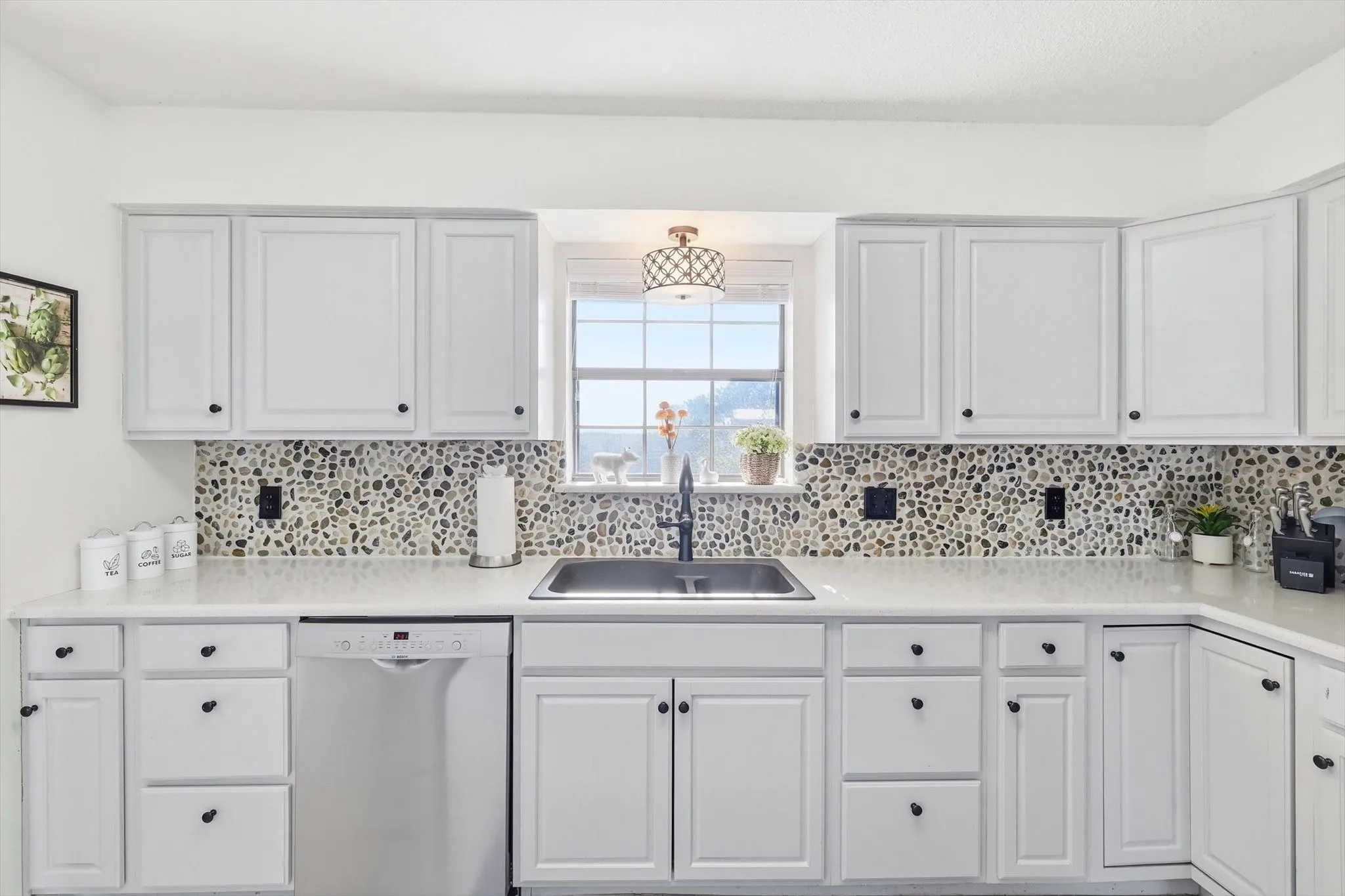 Gorgeous painted cabinets, new countertops, flooring, and backsplash!