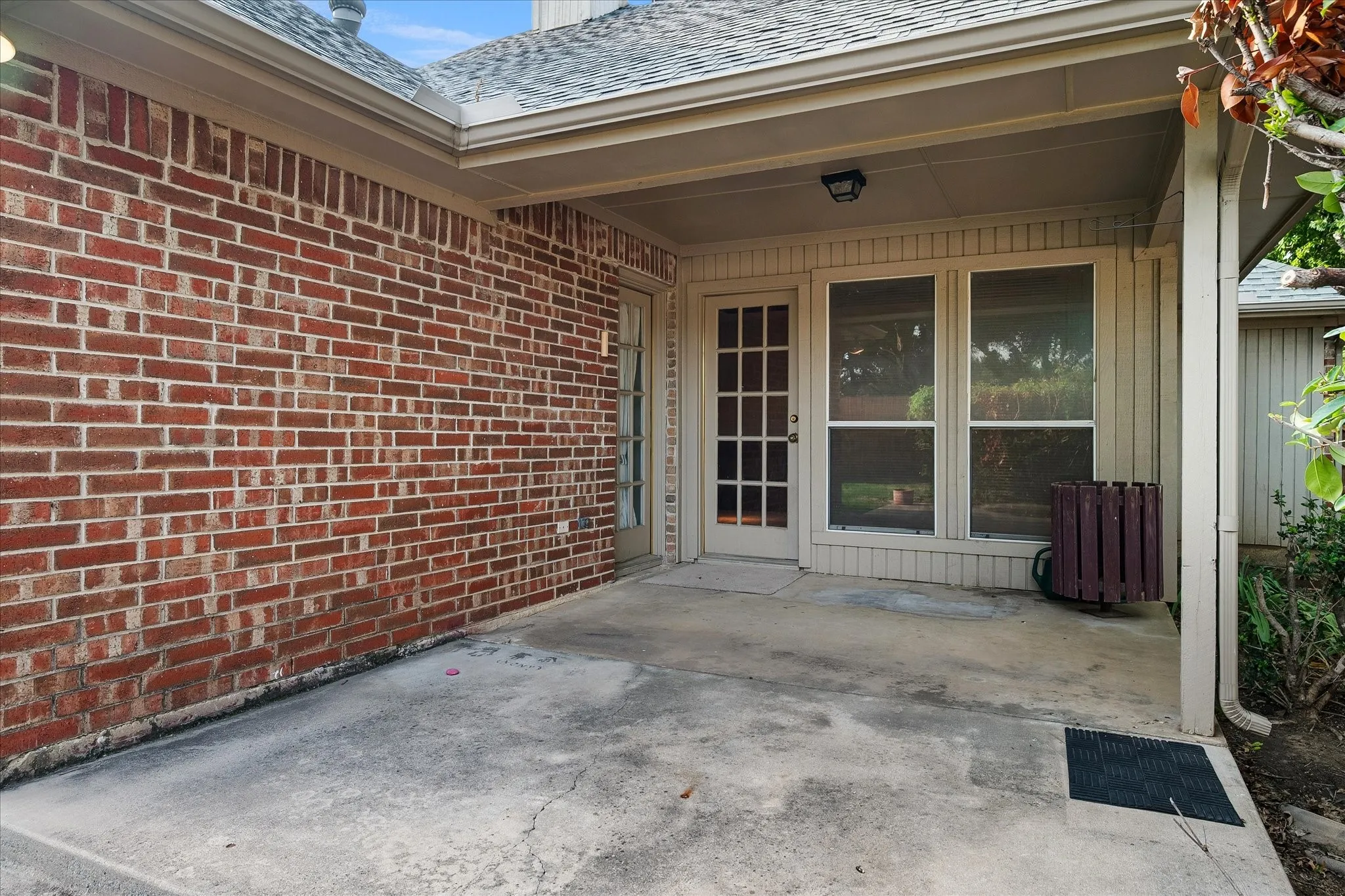 Patio and rear entry to primary bedroom and the secondary living room