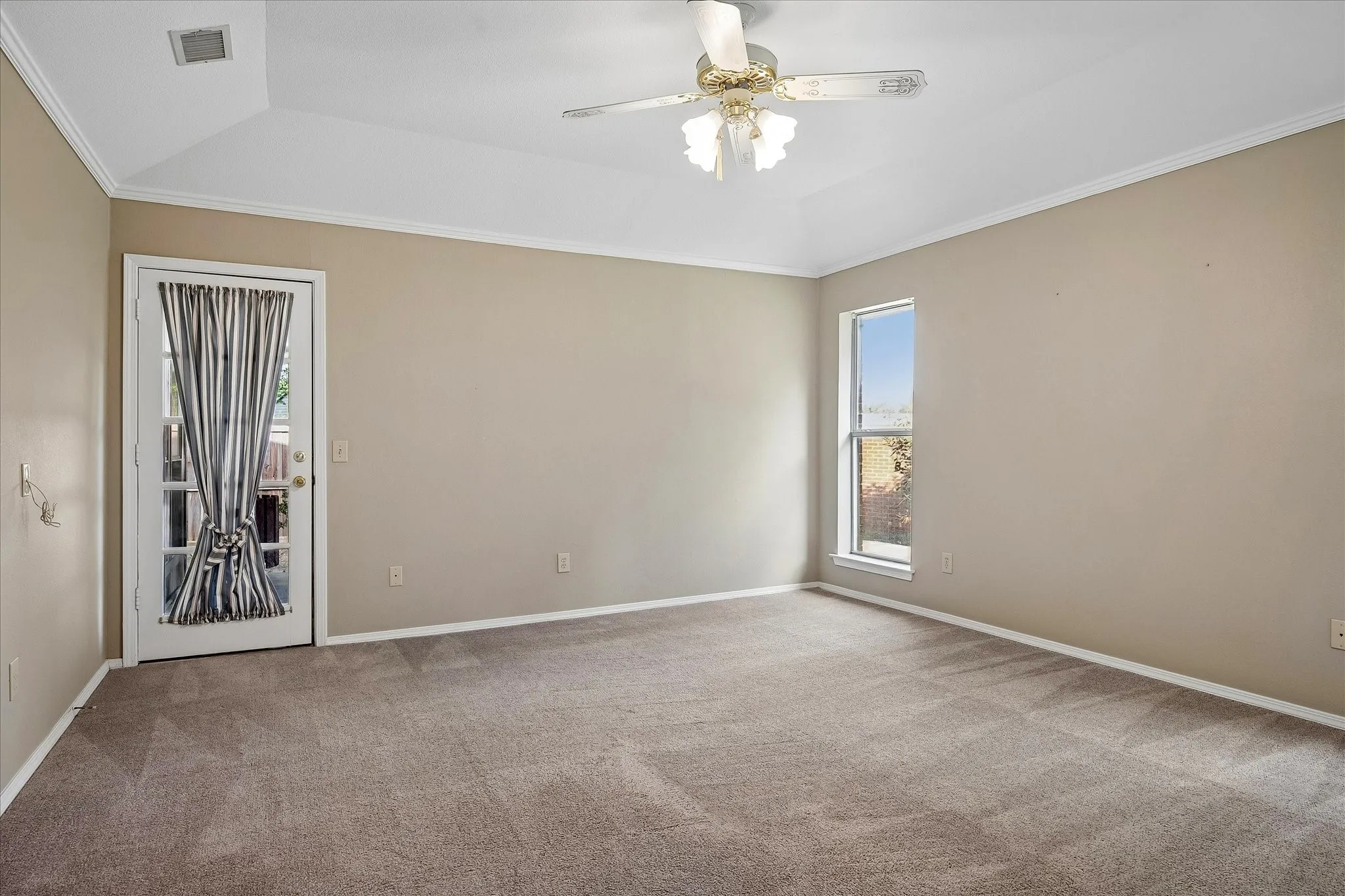 Primary bedroom with direct entry to rear patio.