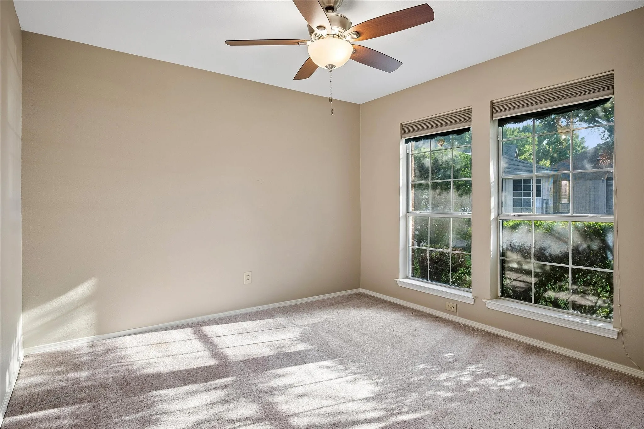 Third bedroom with front-facing windows.