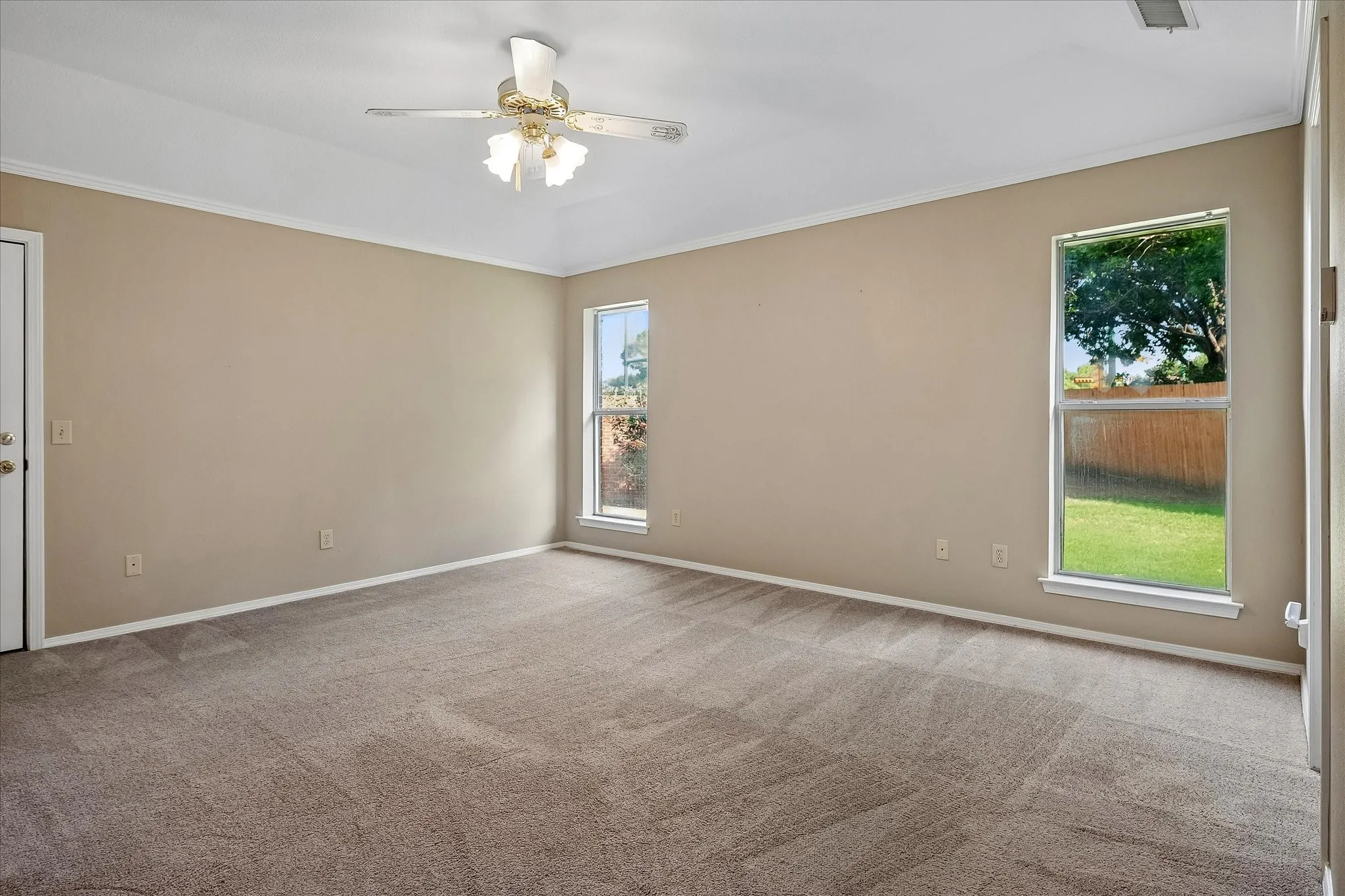 Primary bedroom with southeastern-facing windows.