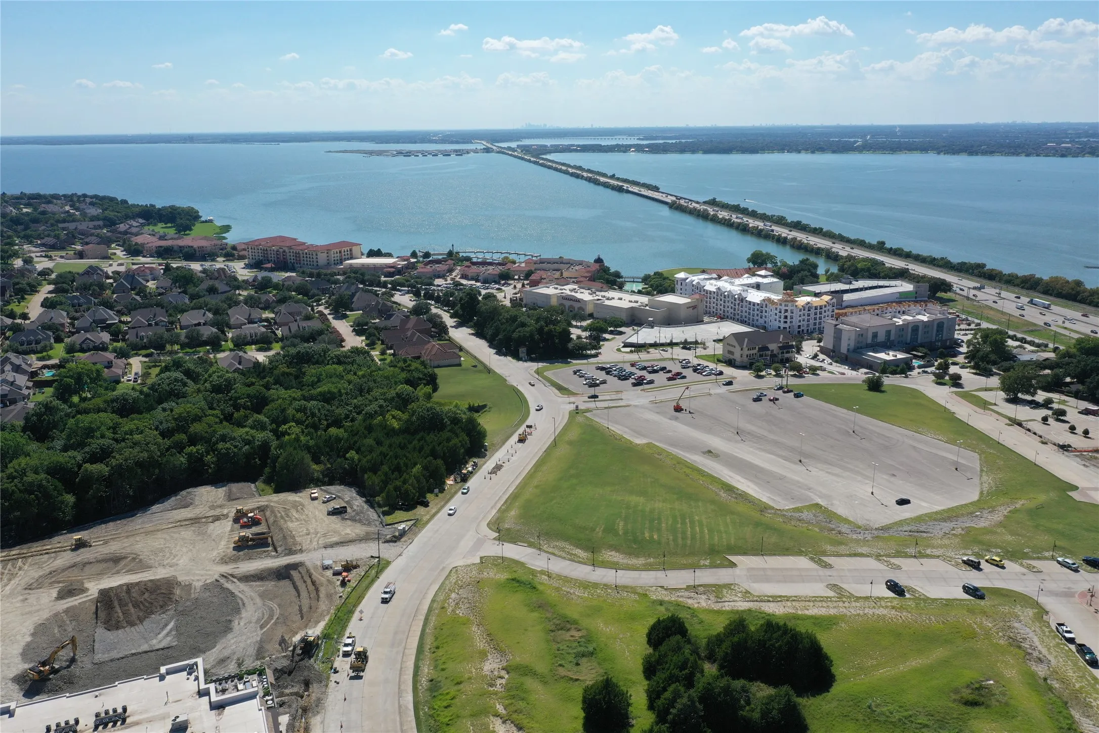 Expansive waterfront setting featuring a prominent bridge spanning a large body of water