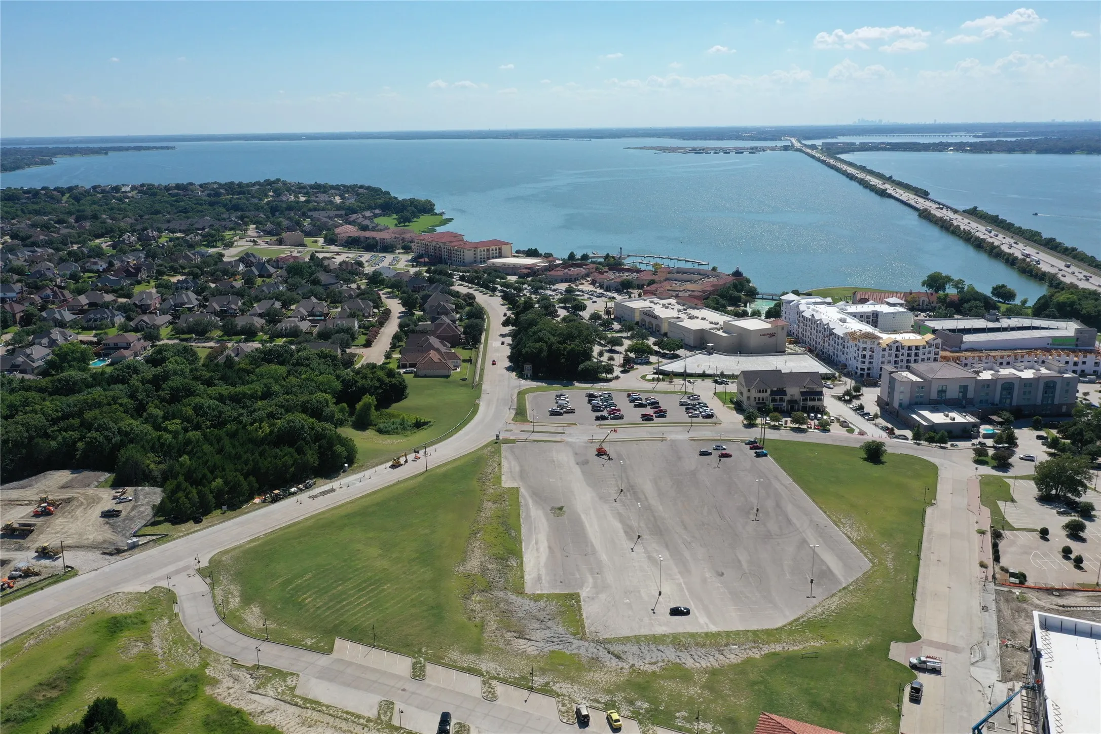 Aerial perspective showcasing a large body of water with a prominent bridge structure