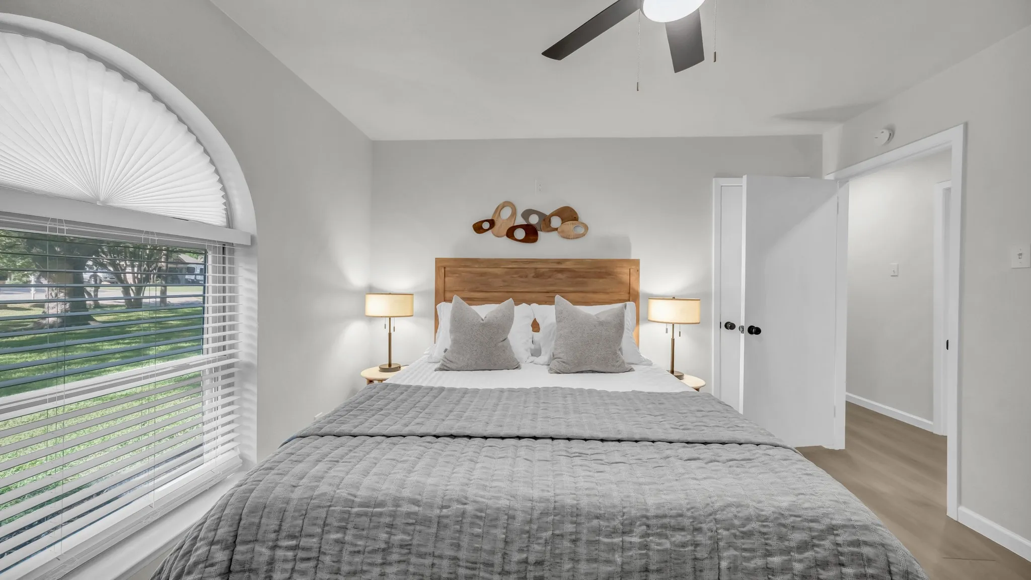 Queen size bed with plenty of extra pillows, sheets and blankets. 2 night stands with lamps