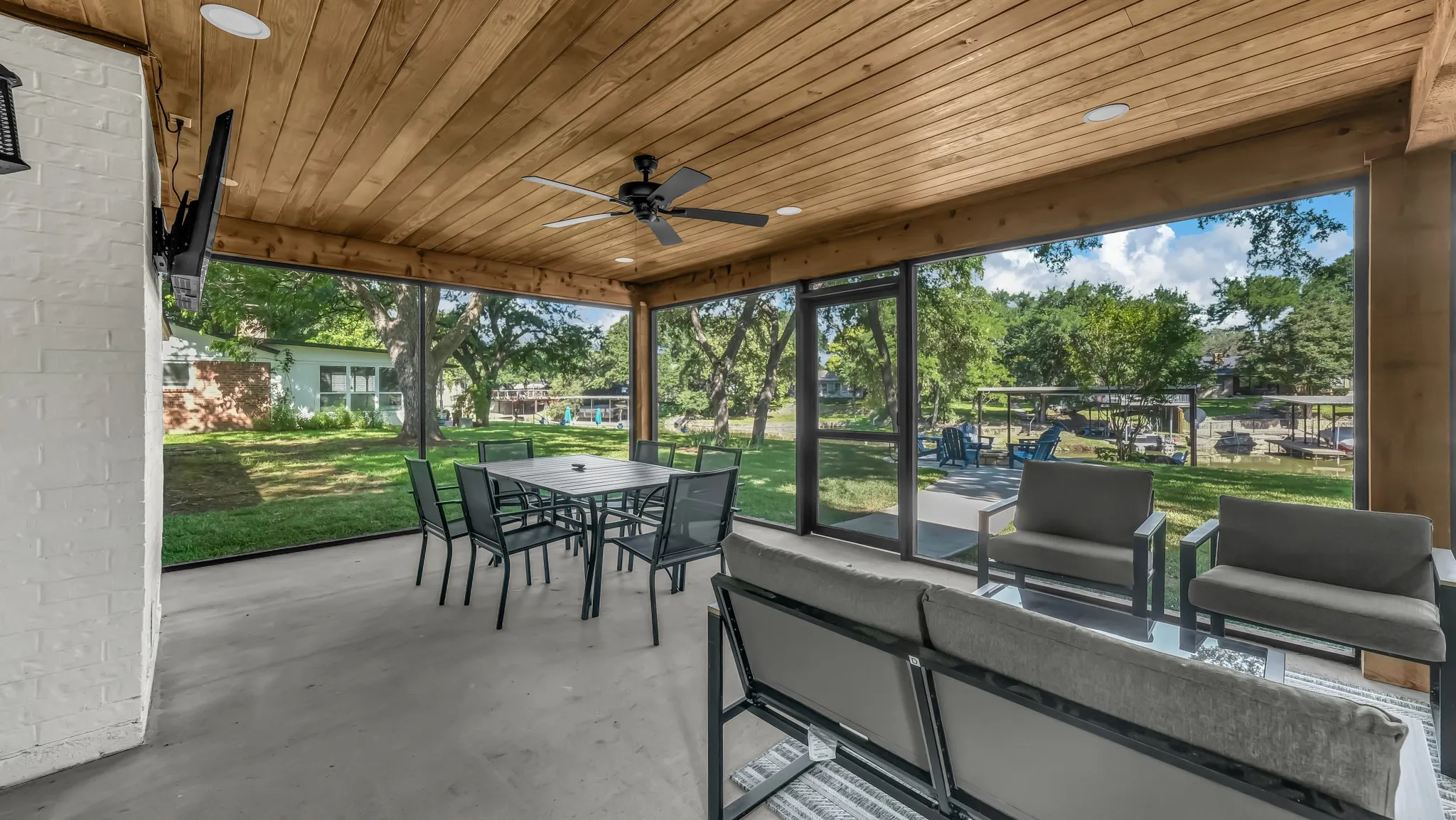The screened in porch is a favorite of everyone's! With plenty of seating, lighting, fan and Smart TV