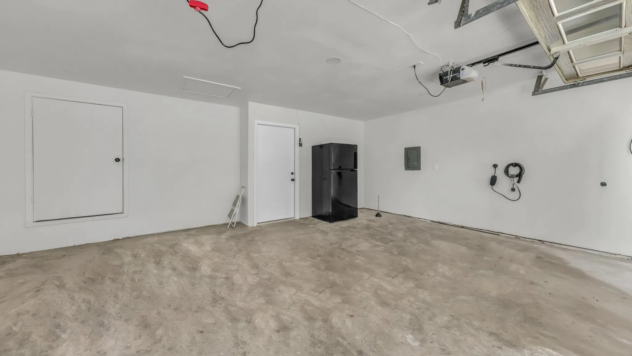 Full size refigerator and freezer in the garage for your use. Ev Charger