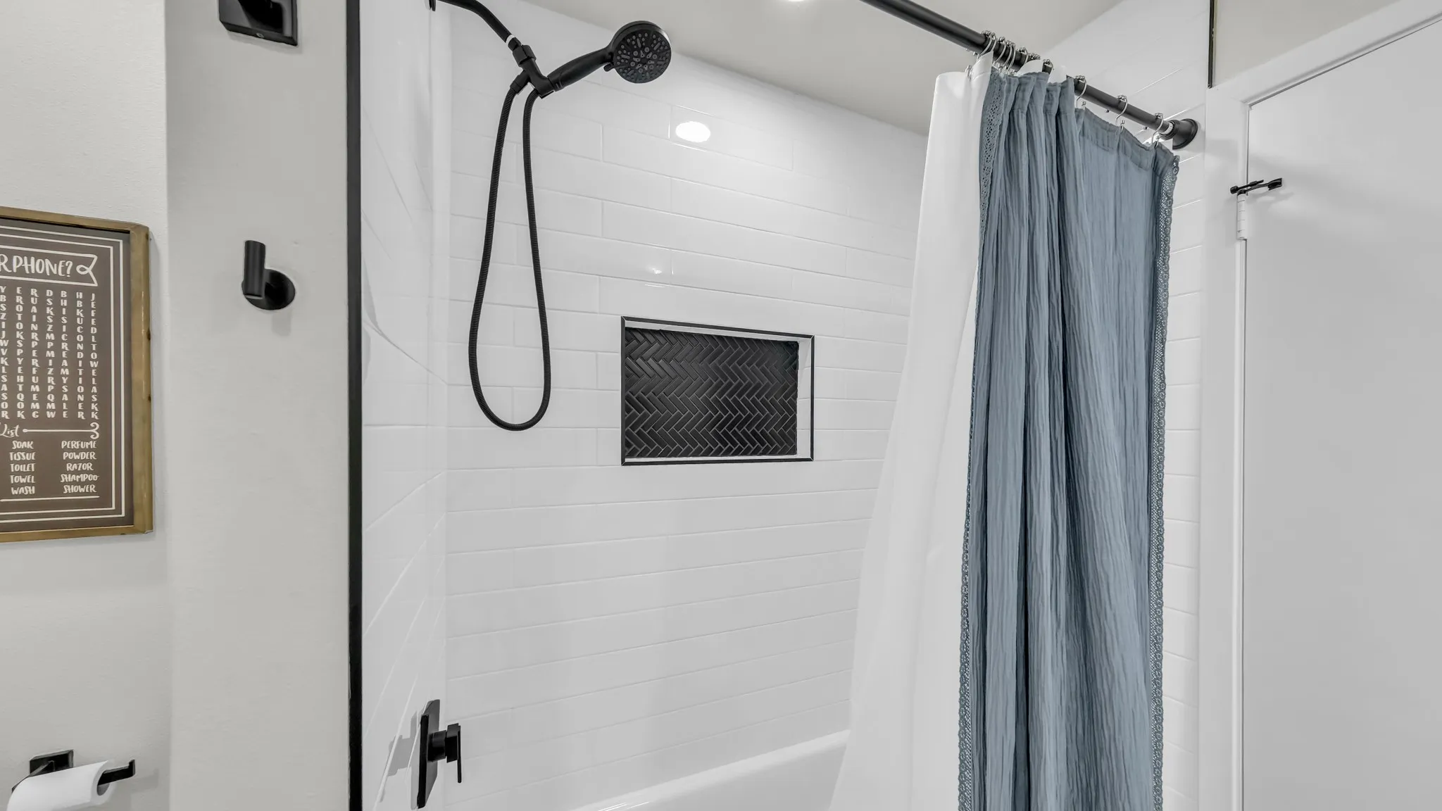 Hallway bathroom with tub and shower