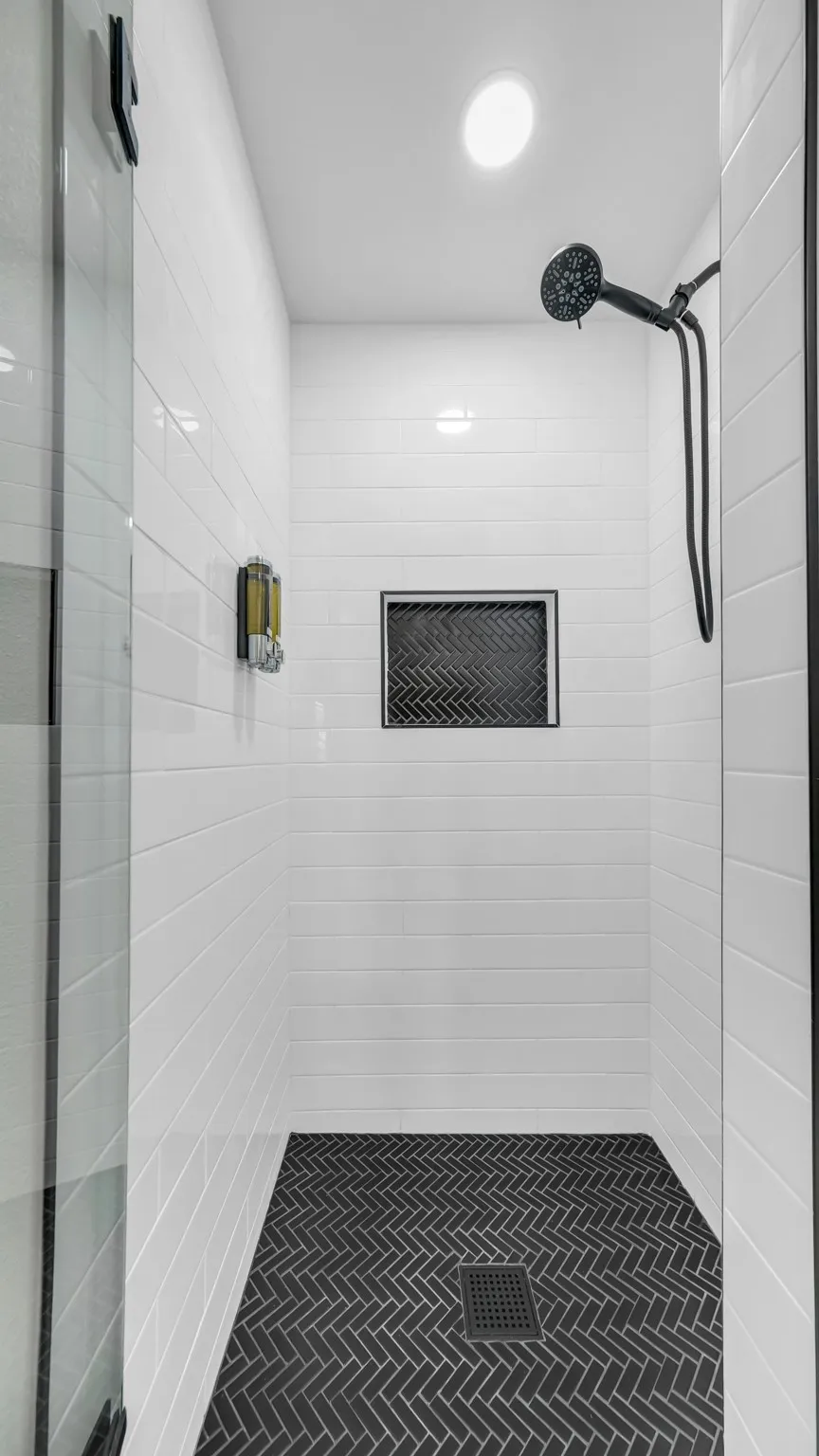 Shower with removable shower head wand. Shampoo and body soap provided.