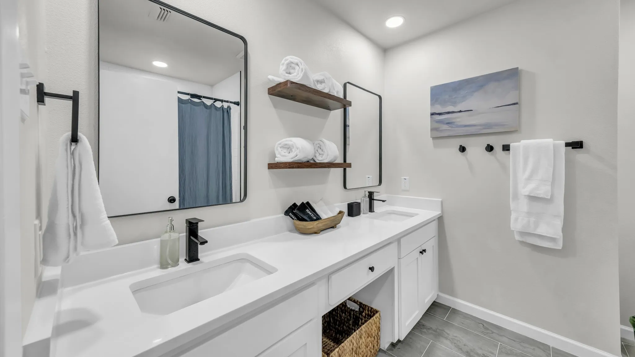 Hallway bathroom with double sinks