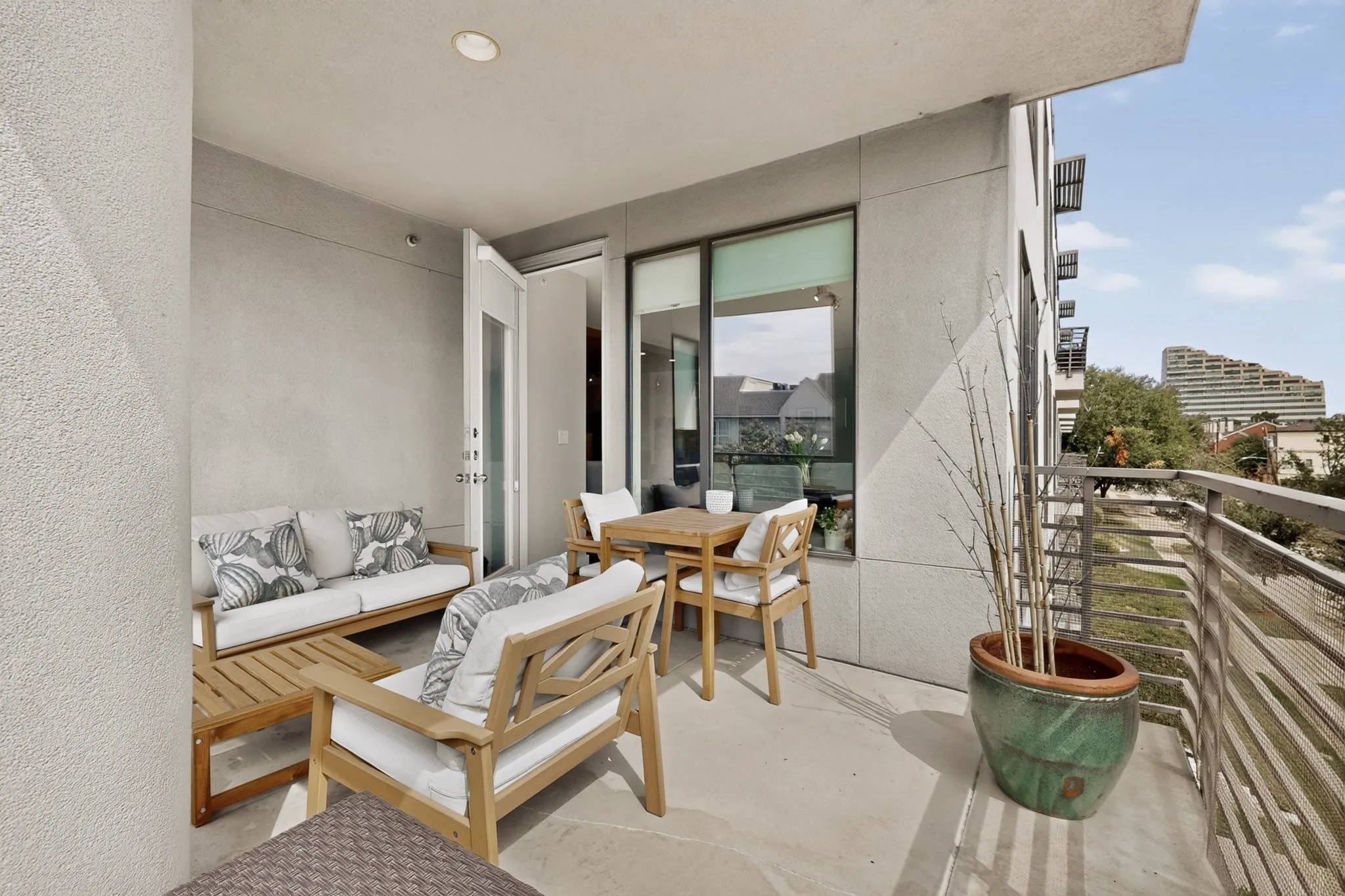 Private balcony featuring a concrete floor and neutral-toned exterior walls
