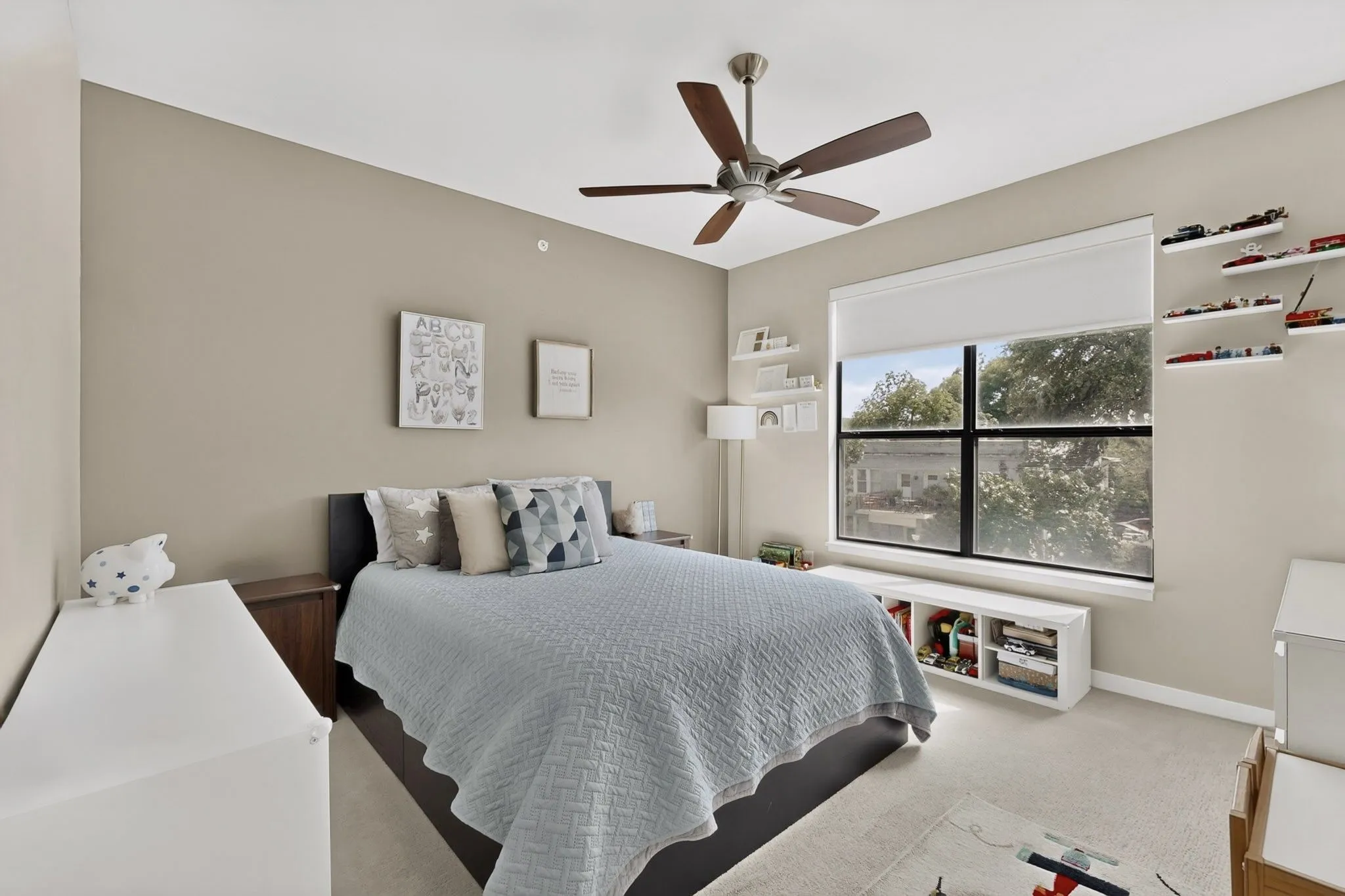 Room featuring light-colored carpeting and neutral wall tones