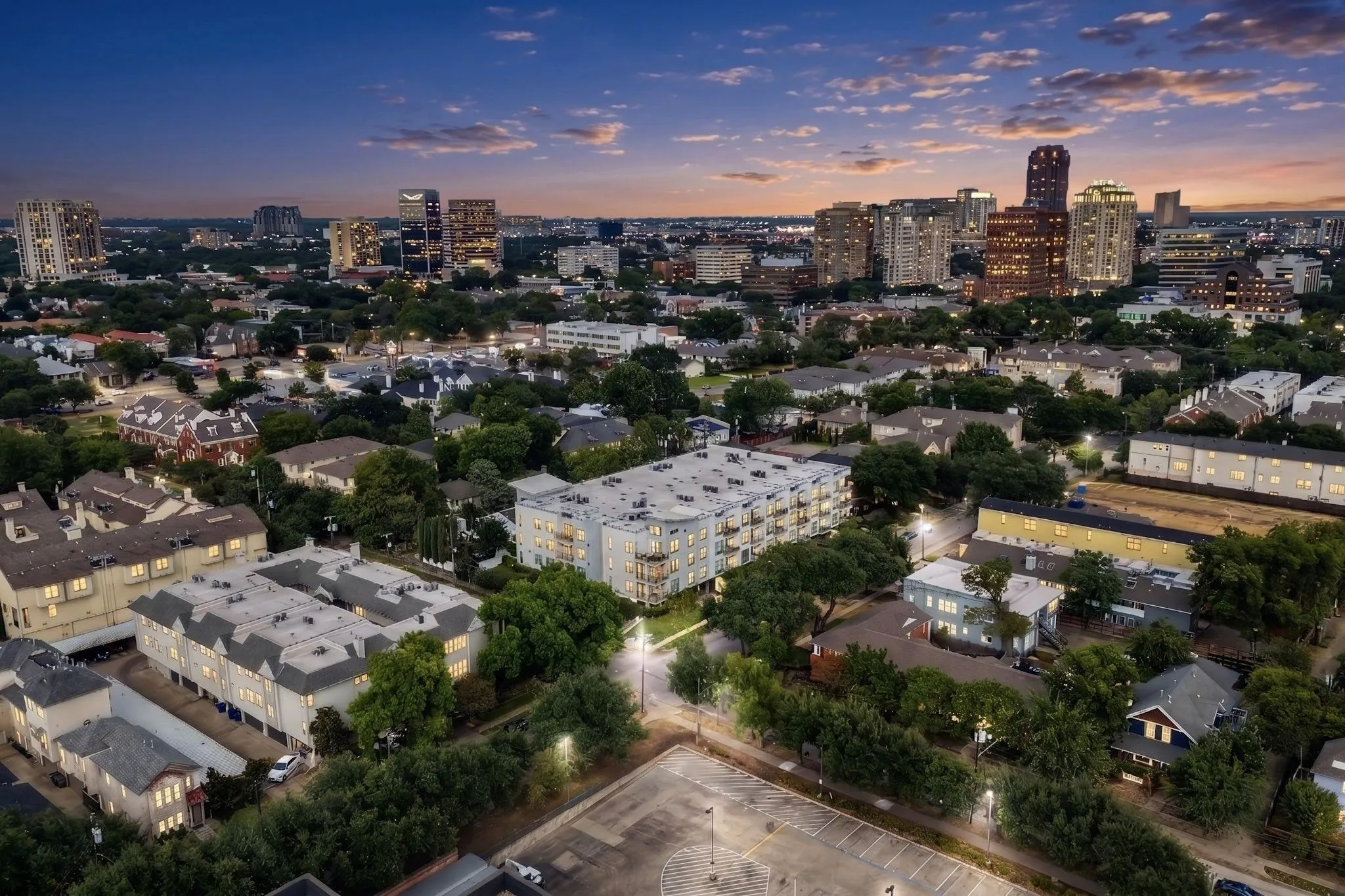 Aerial perspective showcasing a residential neighborhood with a distant cityscape