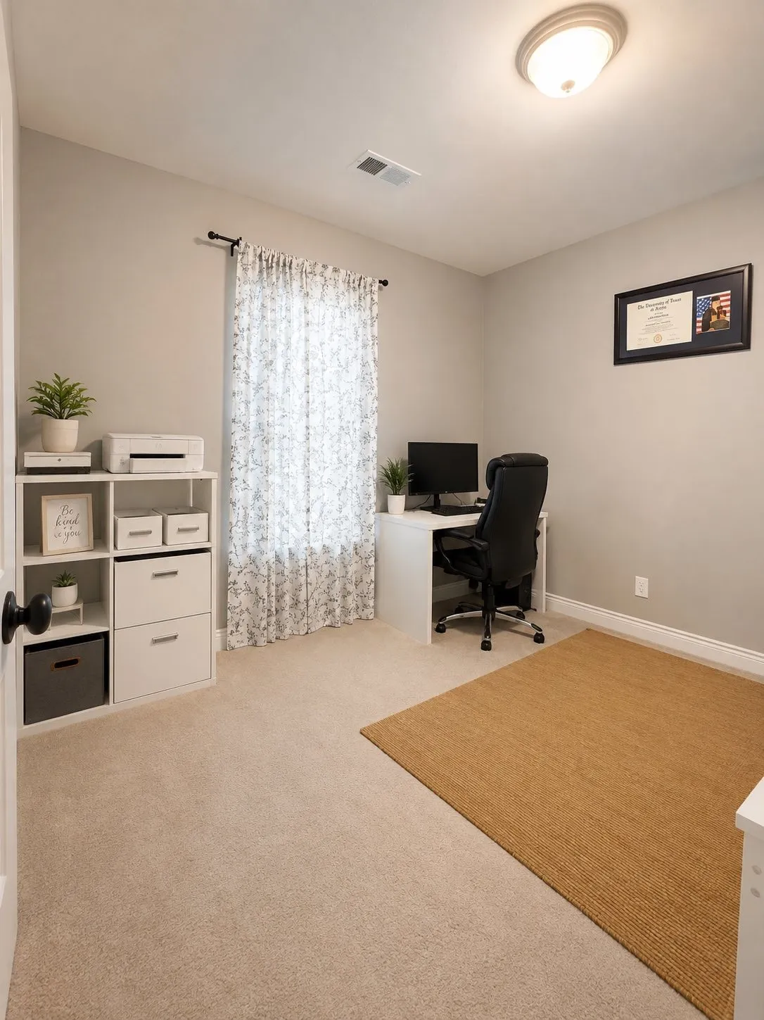 Neutral tone wall paint, carpeted flooring, white trim, and a semi-flush mount ceiling light