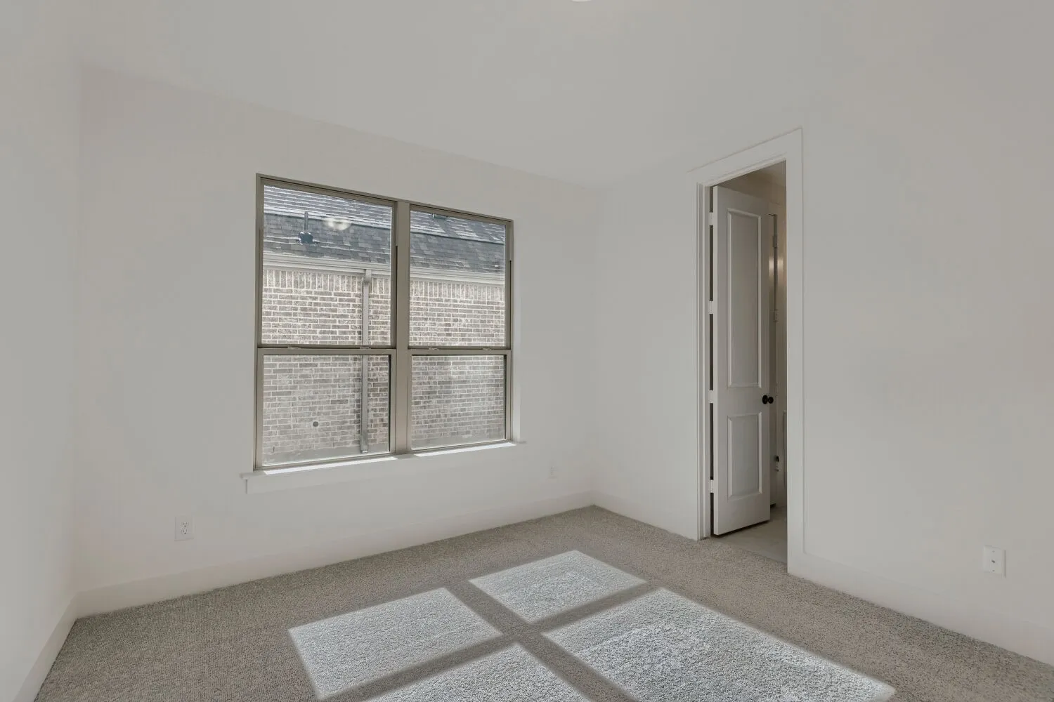 Wall-to-wall carpeting and white walls