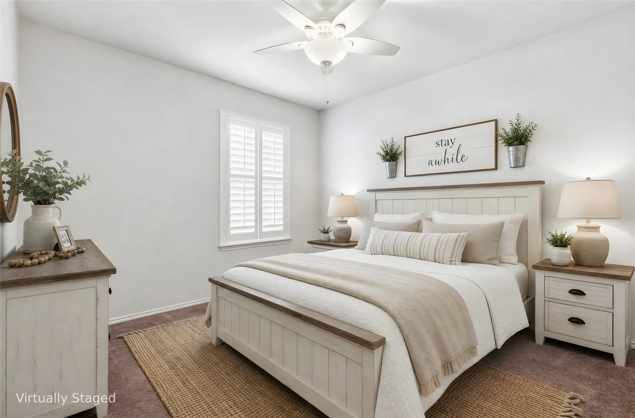 Neutral-toned bedroom featuring a ceiling fan with integrated lighting, wood-finish flooring, and a window with plantation shutters