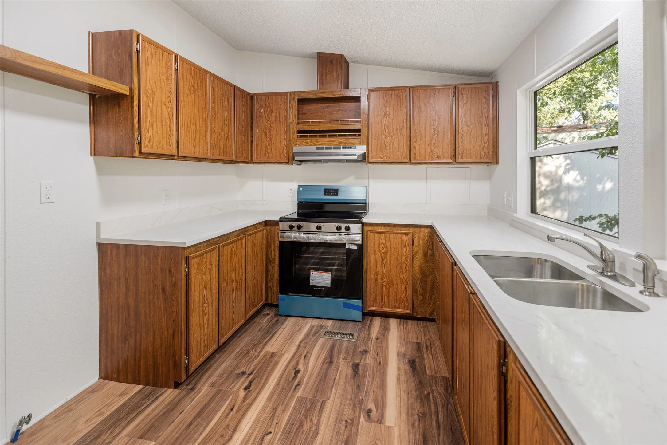 Kitchen showing new quartz counter tops
