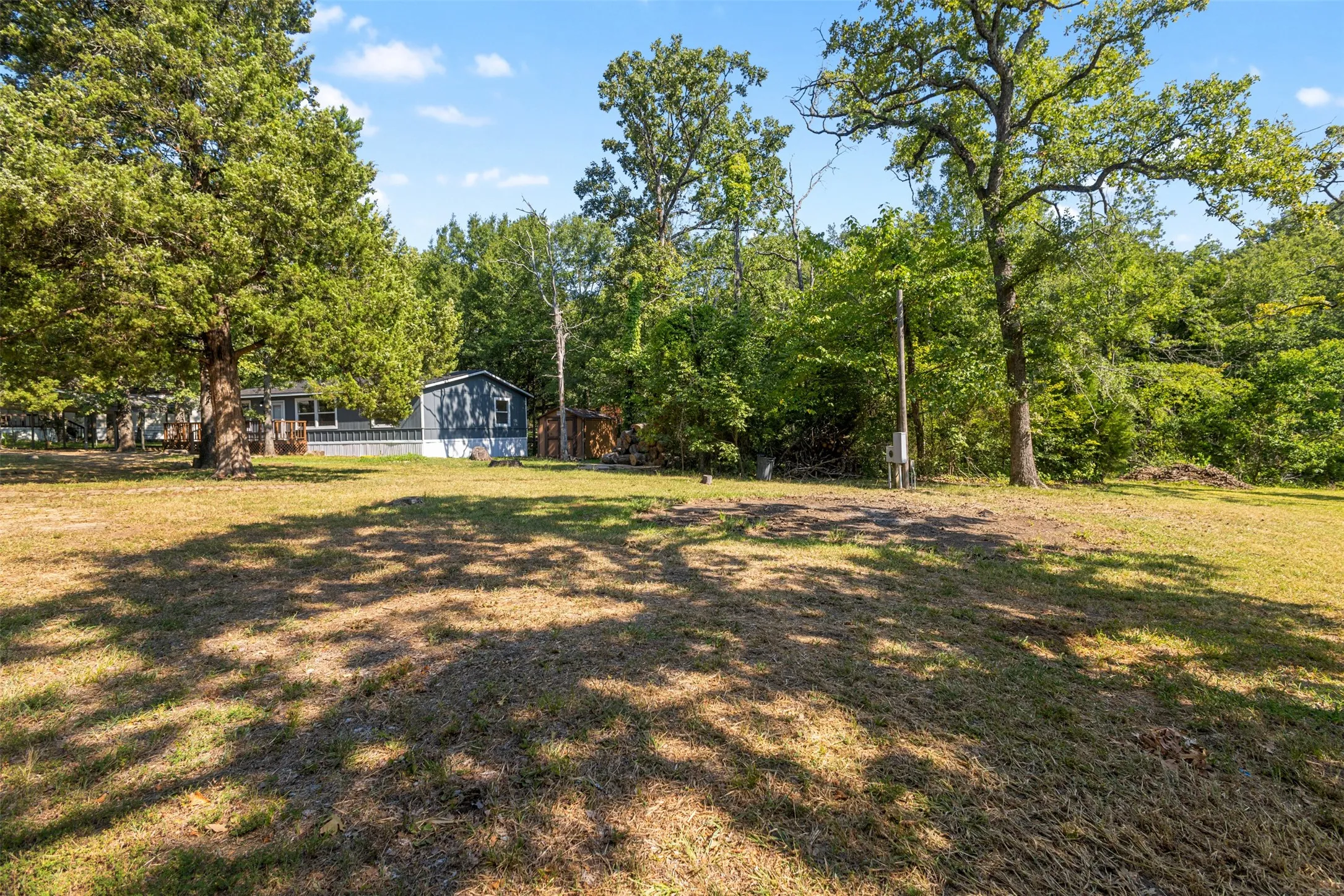 Second lot with room to build or add a manufactured home.