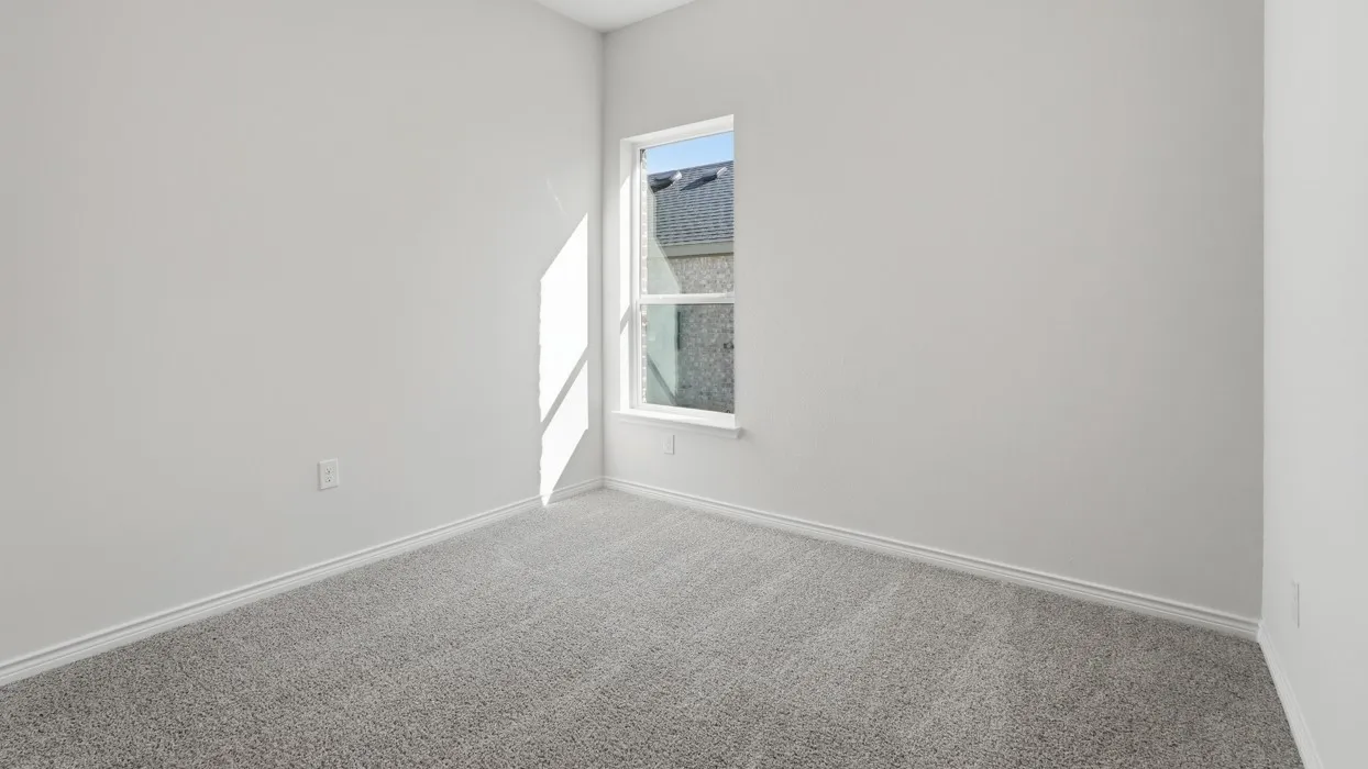 Room featuring light gray carpet, white painted walls, white trim, and a double-pane window
