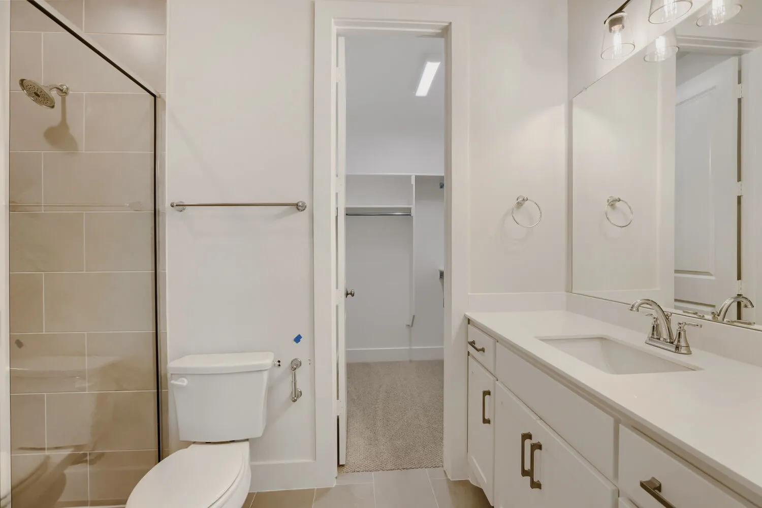 Vanity with single basin, undermount sink, and brushed nickel faucet