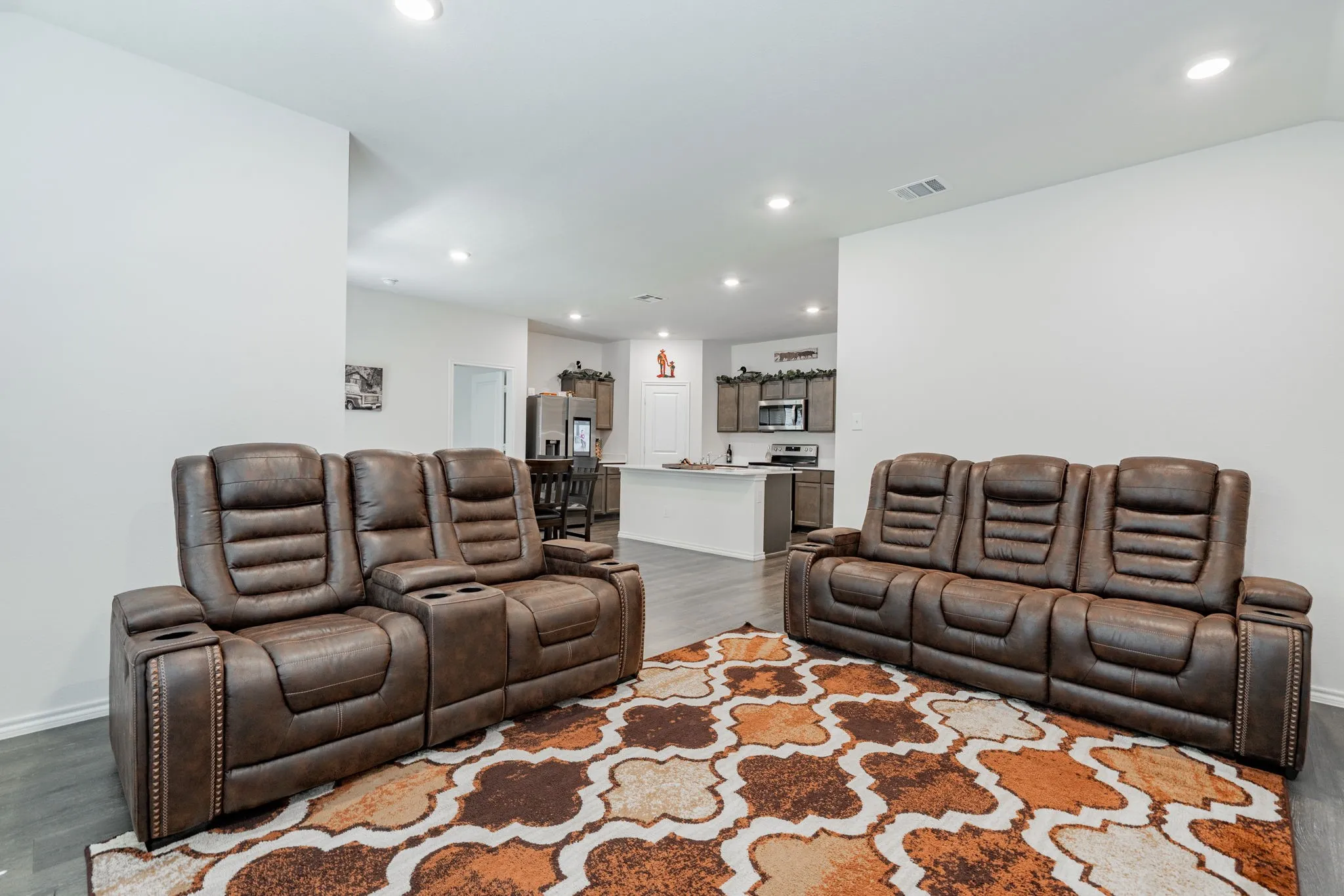 Living area featuring baseboards, recessed lighting, and dark wood-style flooring