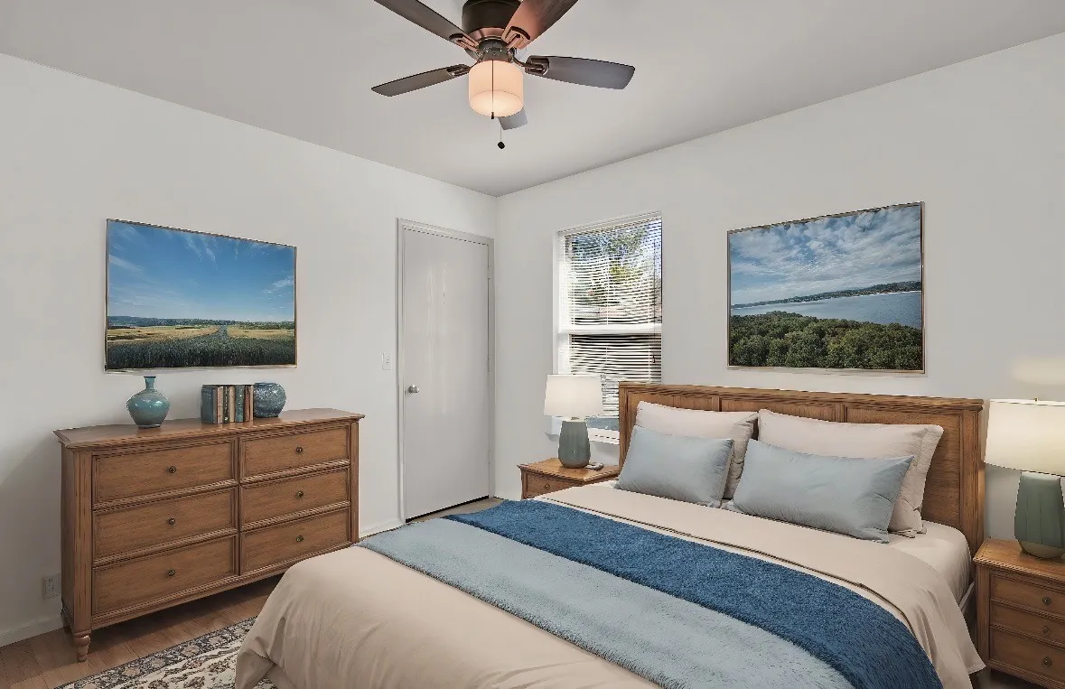 Bedroom featuring a ceiling fan, a window with blinds, and wood-finish flooring