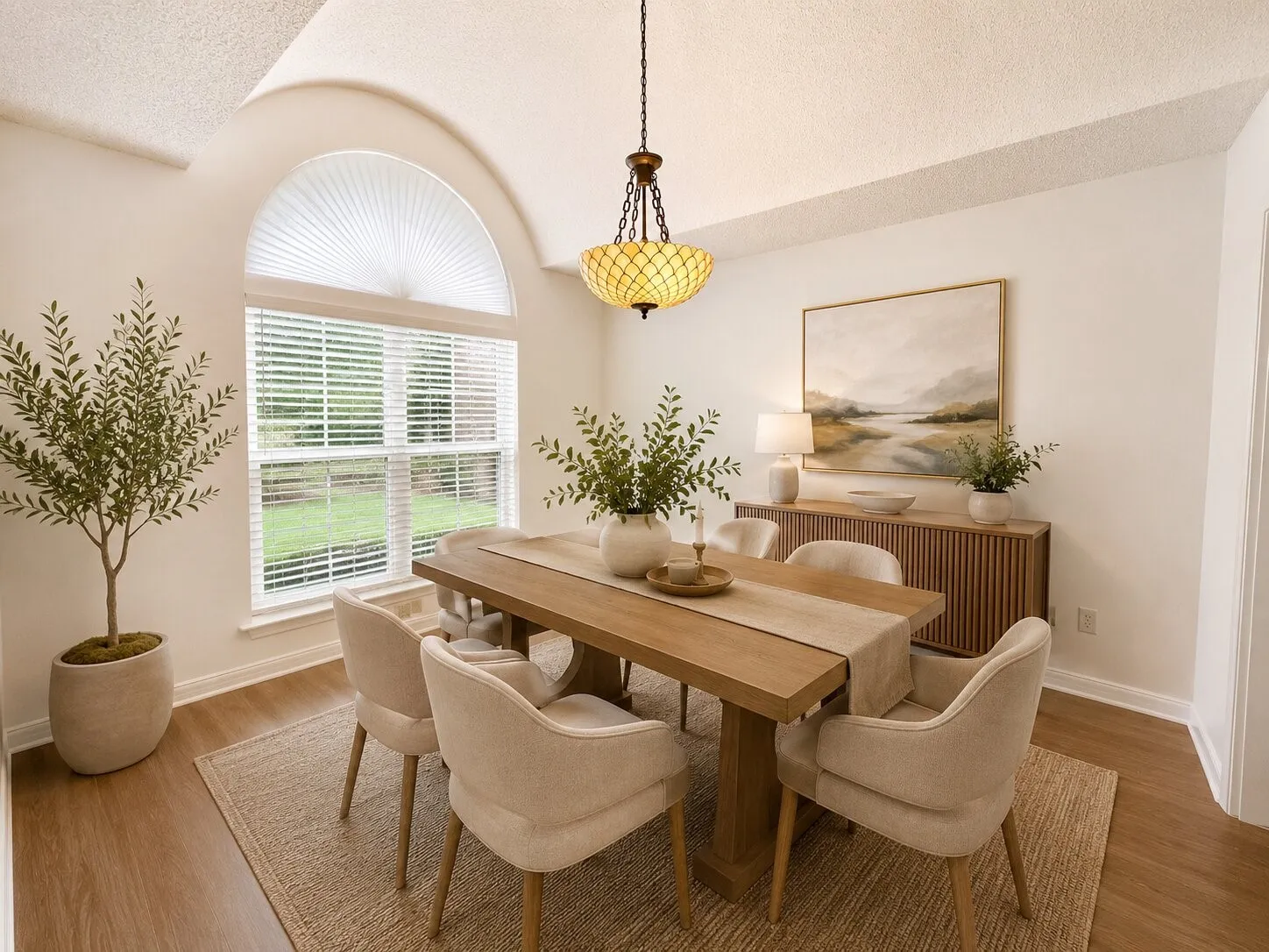 Dining area has been virtually staged