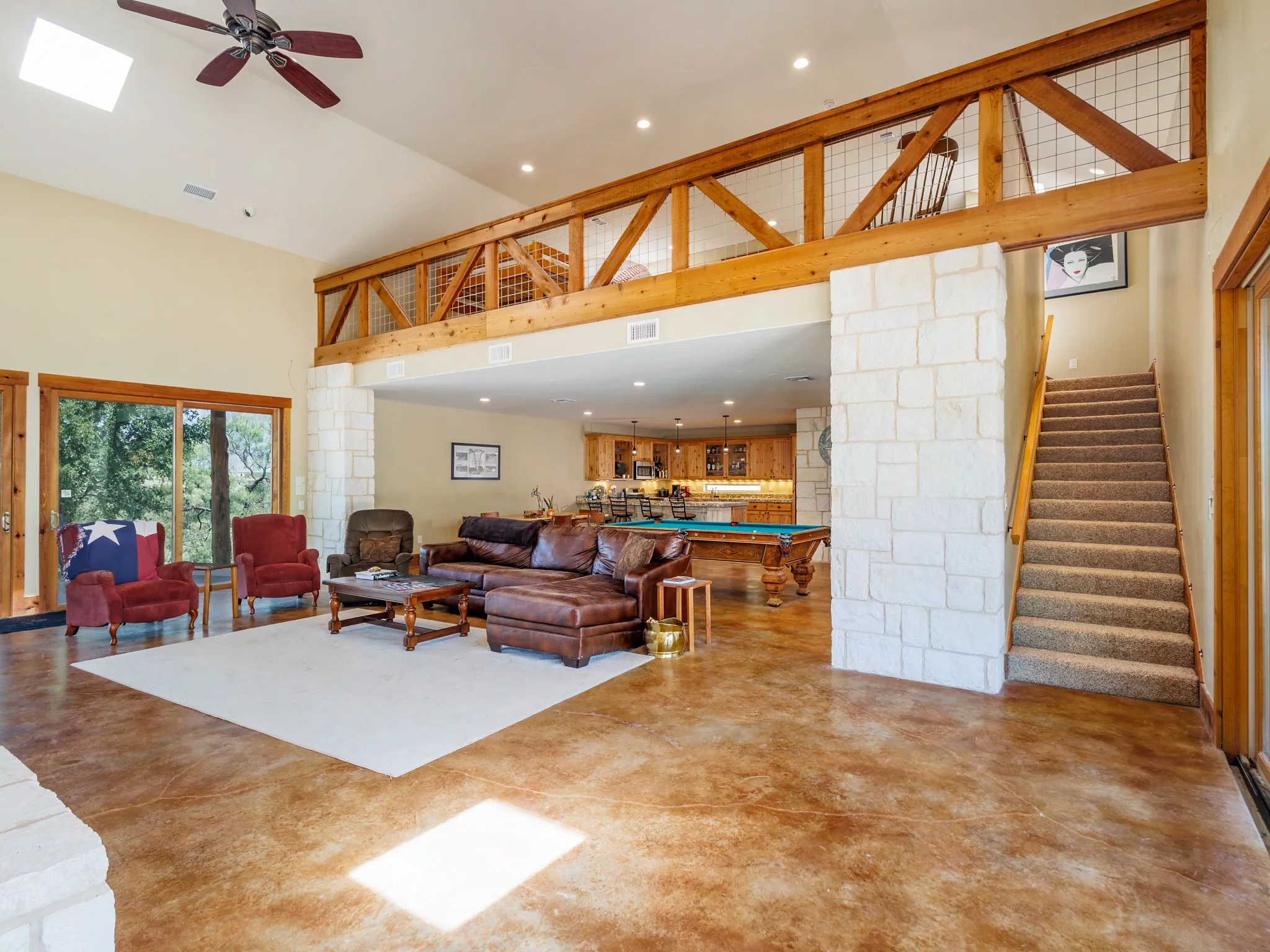 Steps lead to a bedroom loft with room for several guests or family