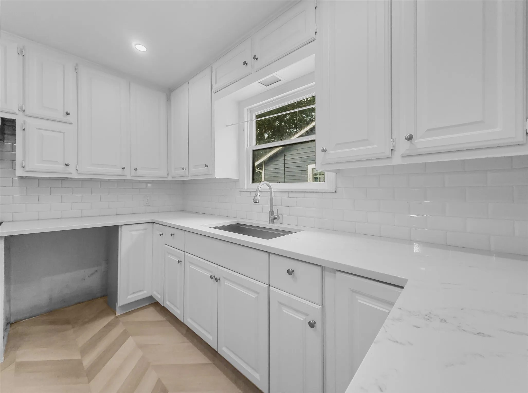 Kitchen featuring quartz counters, undermount sink and tons of cabinet space