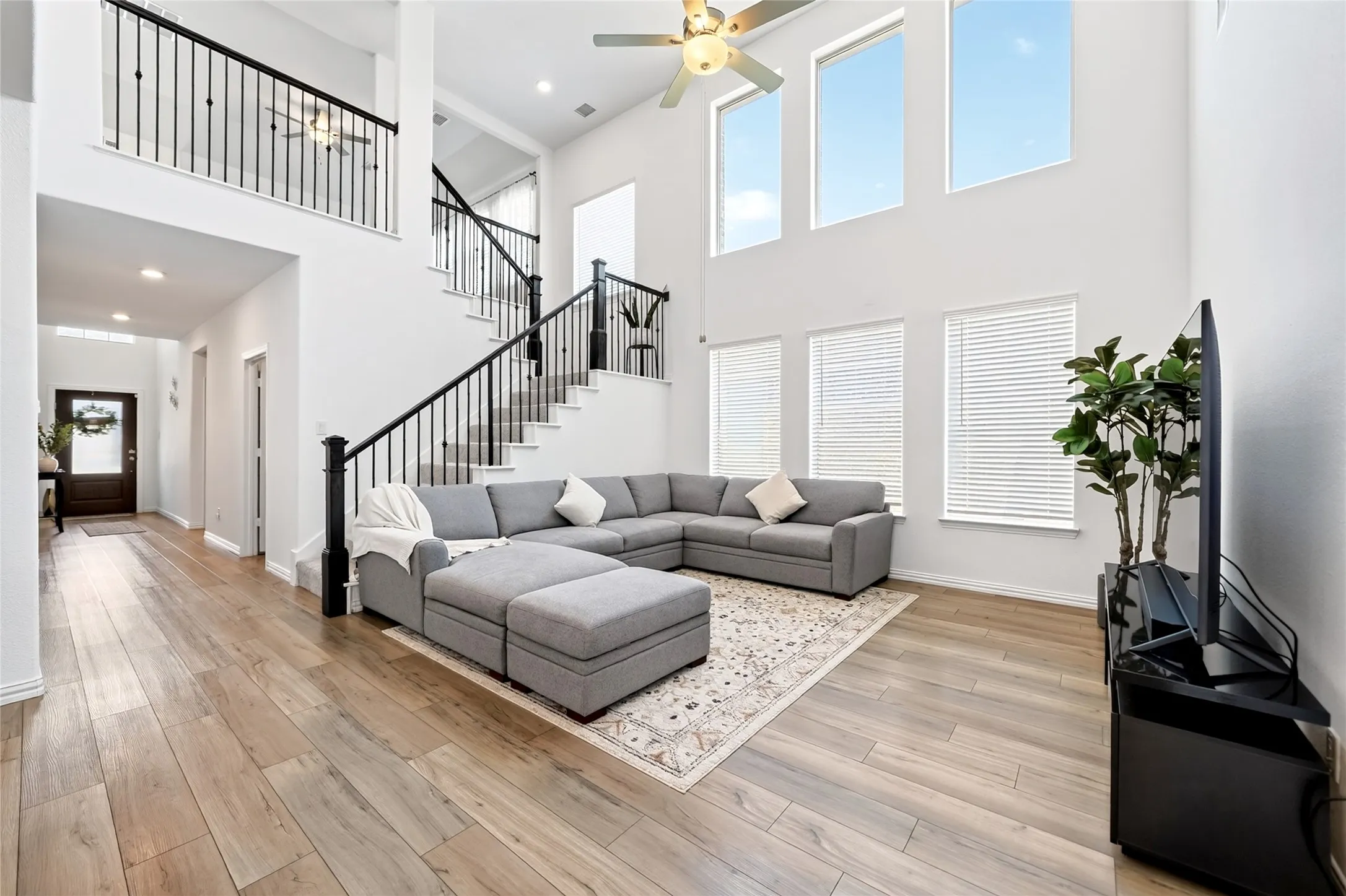 Dramatic living room with high ceilings and tons of natural light
