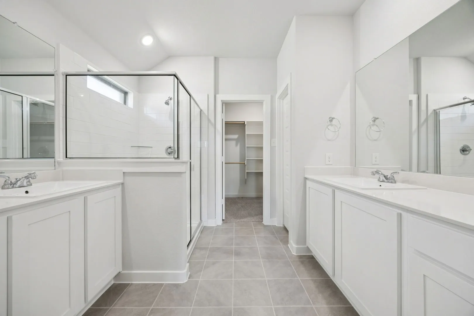 Primary Bathroom in the Heisman home plan by Trophy Signature Homes – REPRESENTATIVE PHOTO