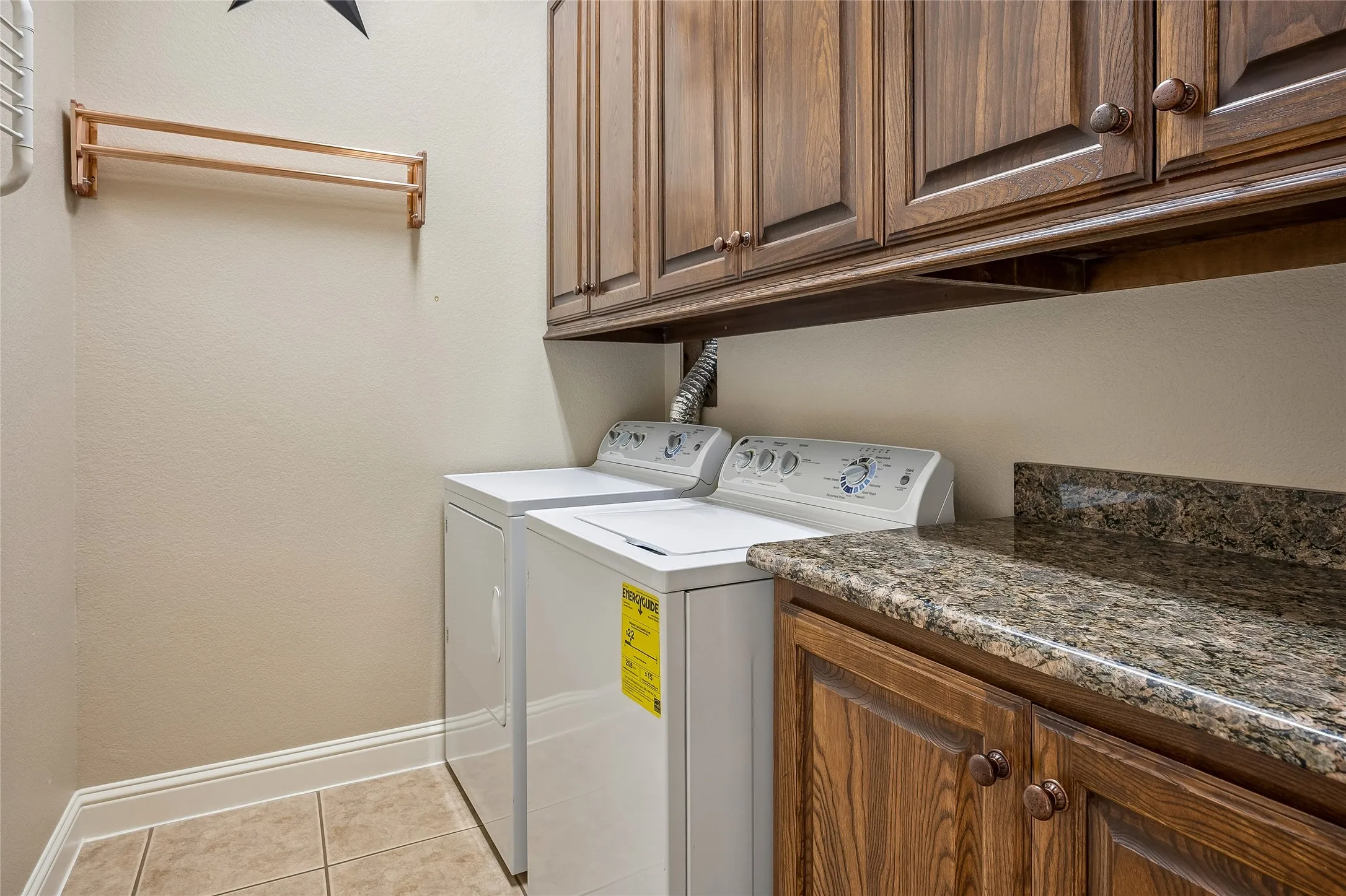 Separate utility room with cabinets