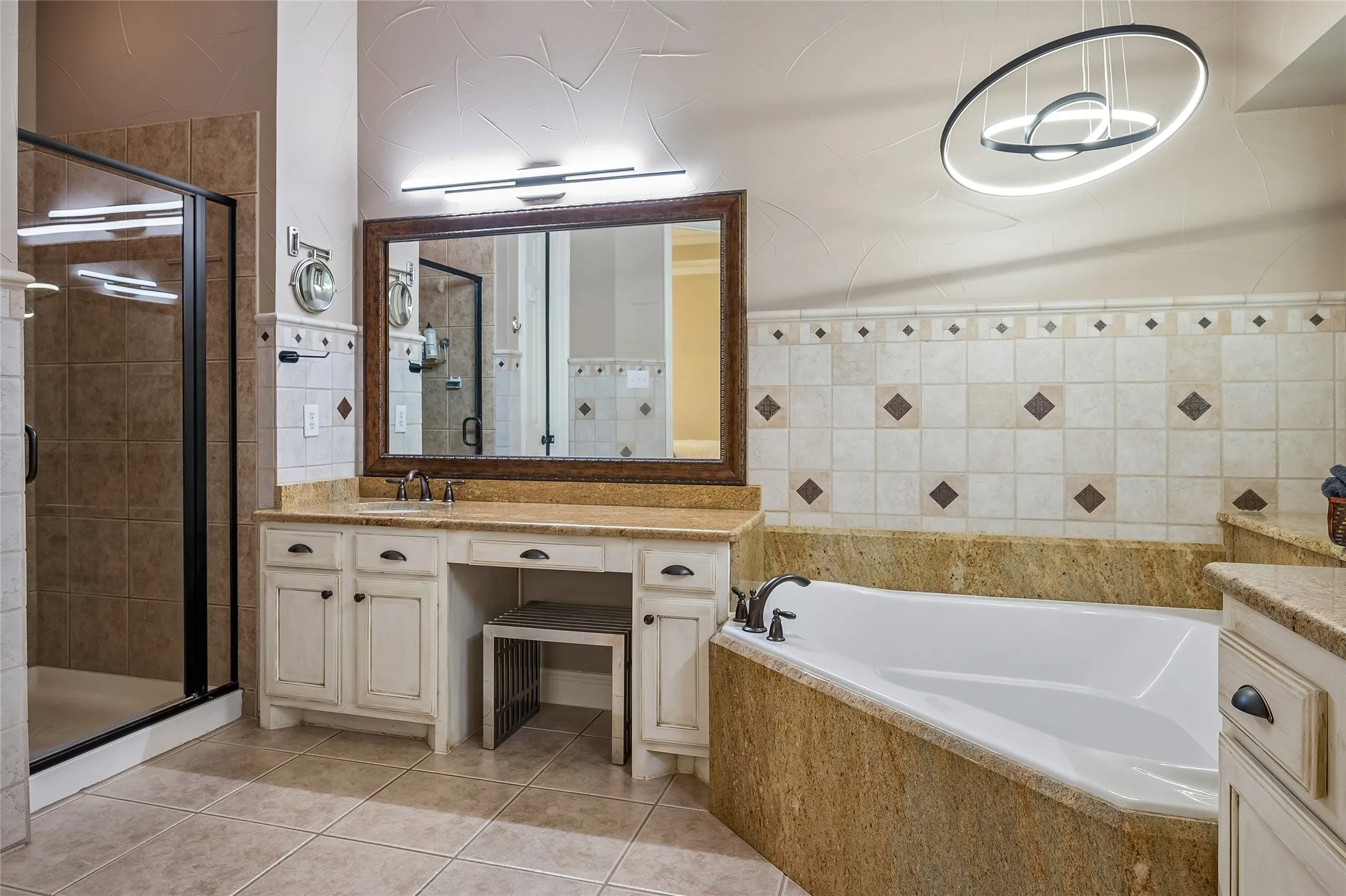 Dual vanities with decorative backsplash