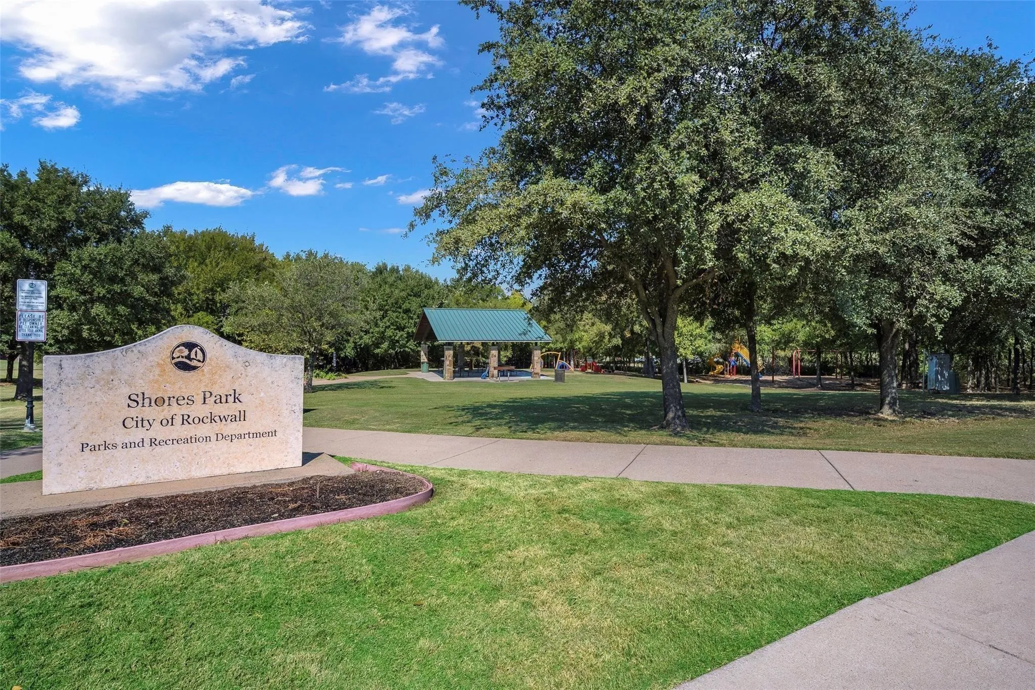 Shores Park with full court basketball, hiking trails, party pavilion, playground and rock climbing