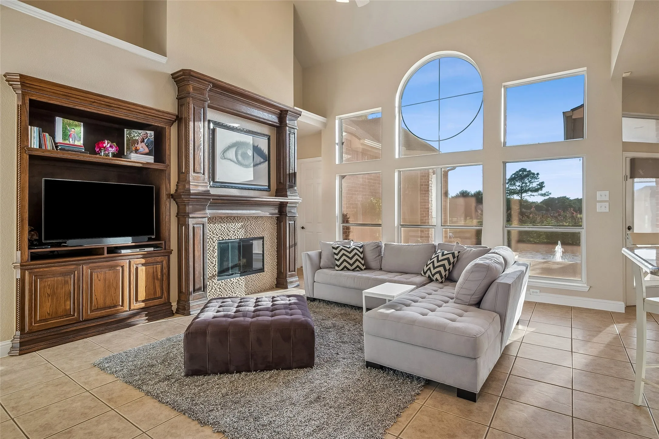 Family room with wall of windows viewing pool