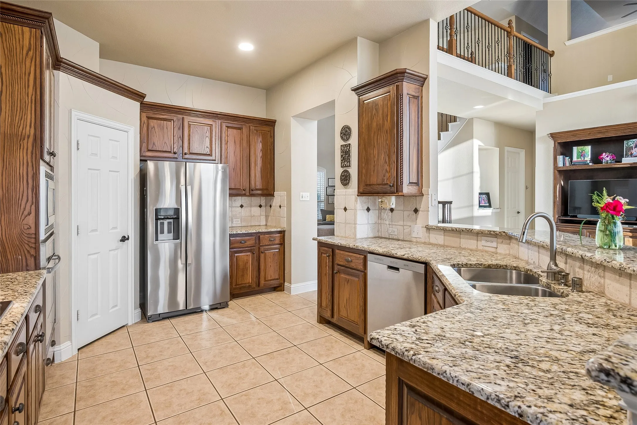 Stainless appliances, walk - in pantry, extended breakfast bar open to family room