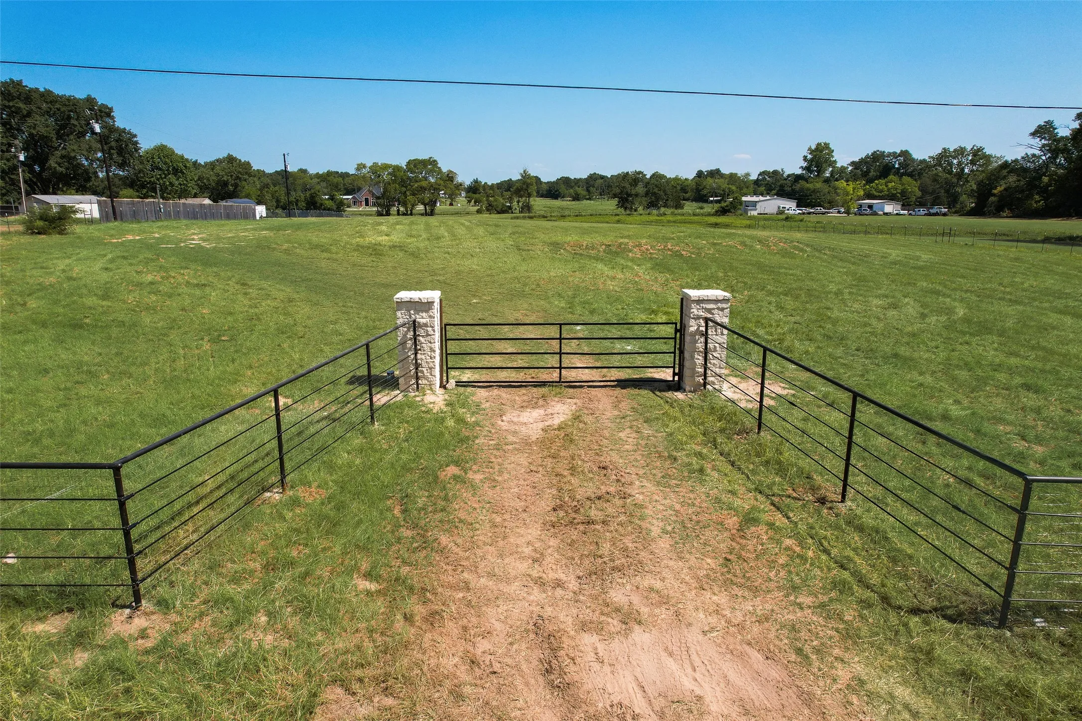 554 VZ County Road 2517 entrance. 253 ft frontage on County Road and 250 ft frontage on Hwy 243.