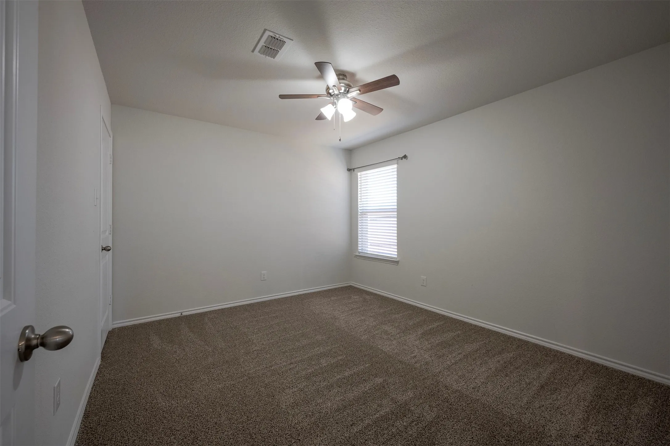 One of THREE Spare Bedrooms - this one located on the Side of the home.