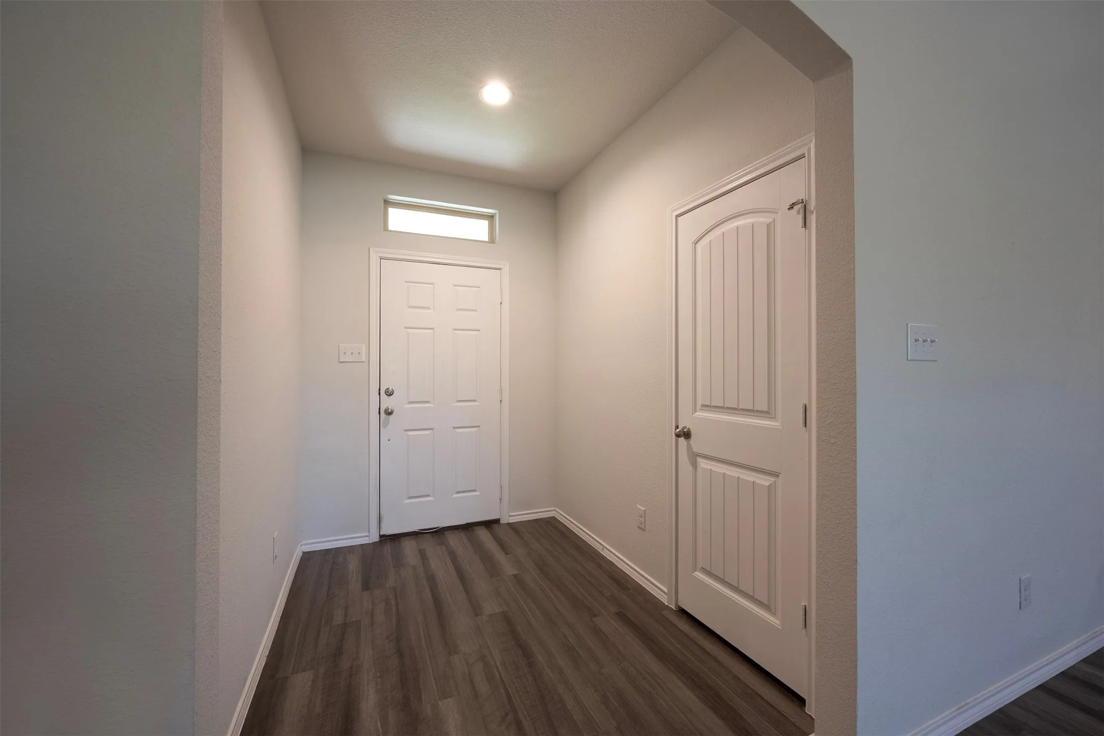 There is room for an entry table for your keys or decor.