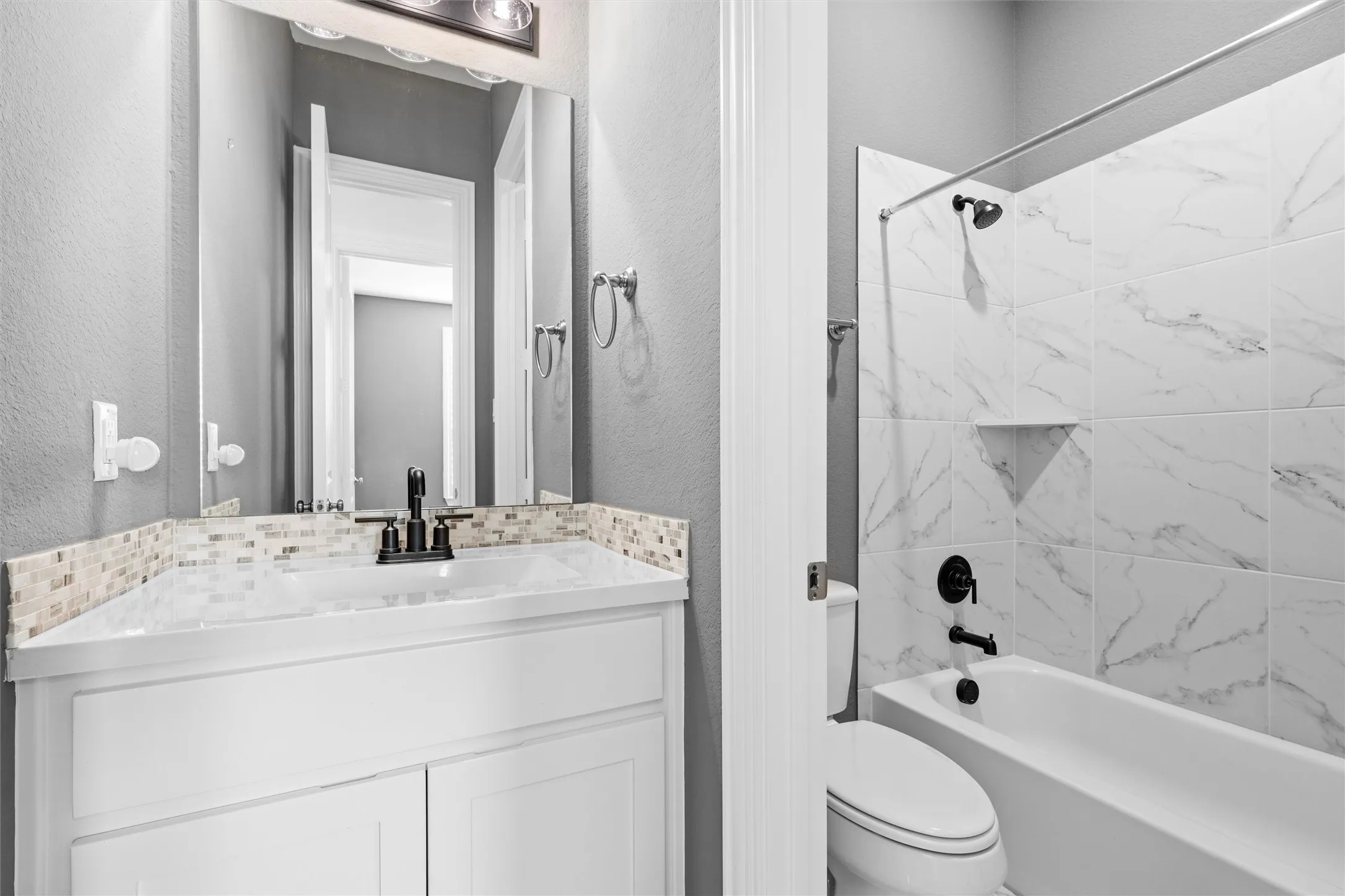 Marble dreams! ?? This bathroom is giving spa day every day. Those marble-look tiles in the shower are stunning! ???? #BathroomGoals #MarbleTile #SpaVibes