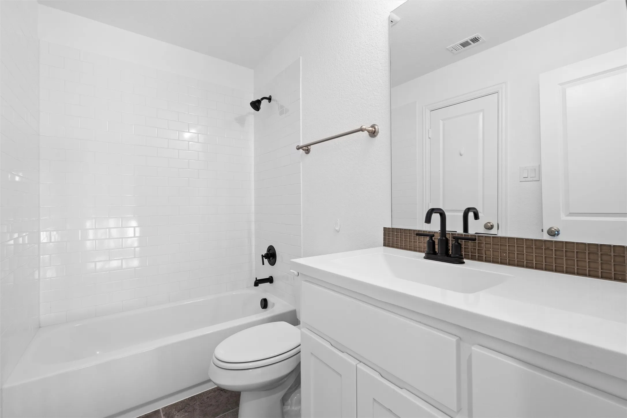Clean, crisp, and classic! ?? White subway tile paired with modern black hardware gives this bathroom a timeless, chic aesthetic. ??? #BathroomDecor #ModernClassics #SubwayTile

