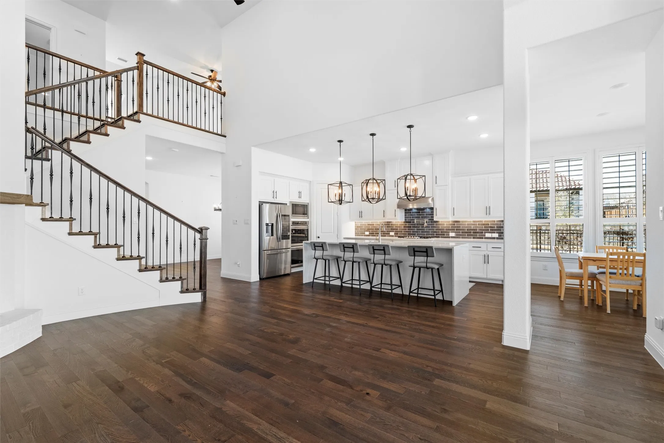 Two-story grandeur! ?? Looking down from the catwalk gives you a true sense of scale. High ceilings, rich hardwood floors, and open-concept perfection! ? #TwoStoryLiving #GrandFoyer #OpenConceptHome