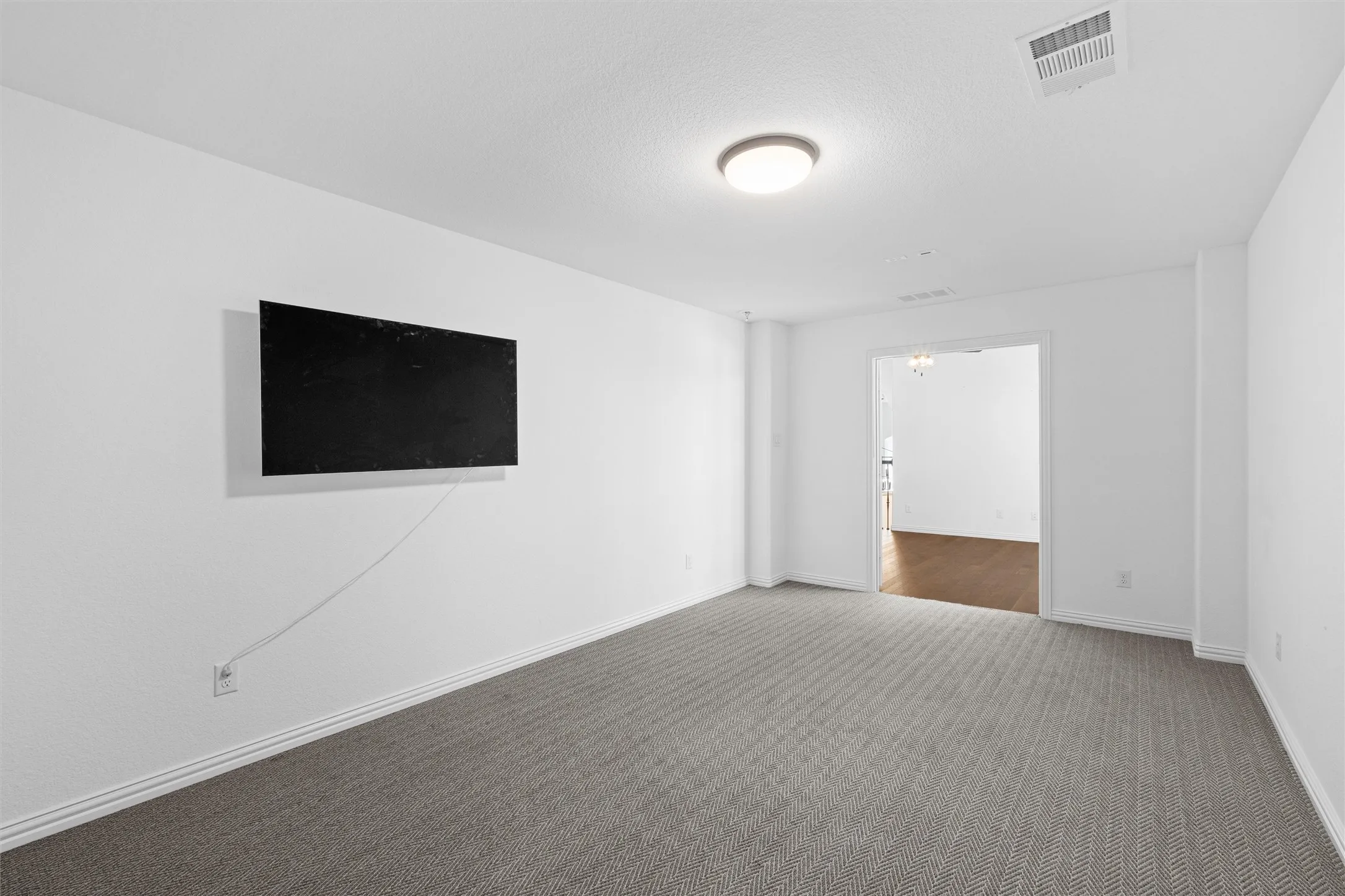 Movie night, anyone? ???? This spacious upper-level media room is ready for the ultimate projector setup or a massive TV screen. Game on! ??? #MediaRoom #HomeTheater #GameRoomGoals
