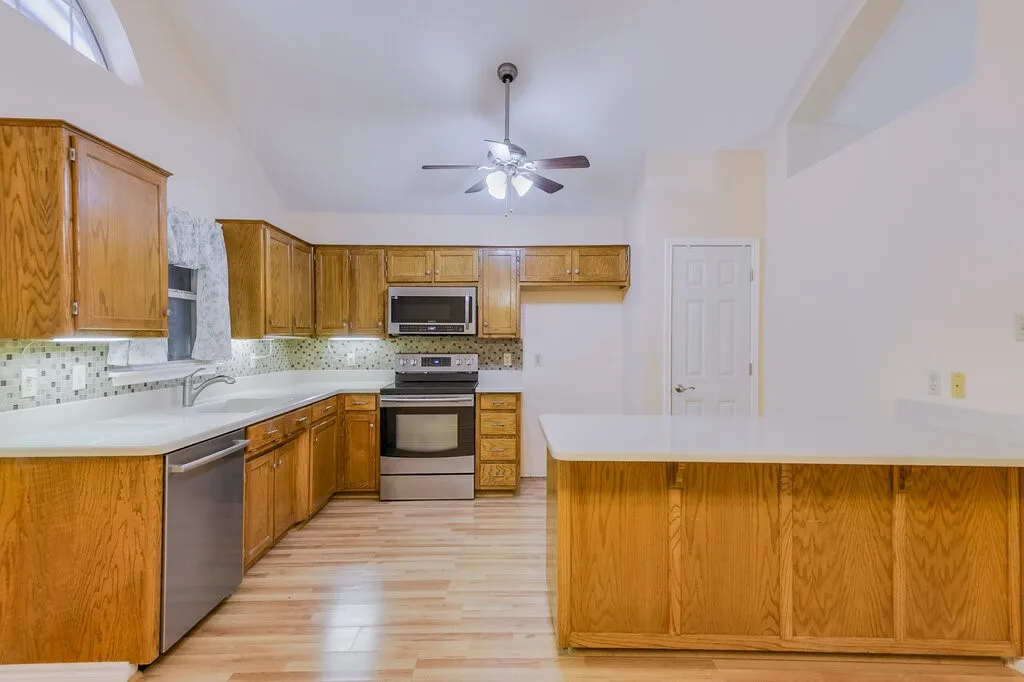 easy access to the primary bath that features a tub and separate walk in shower.