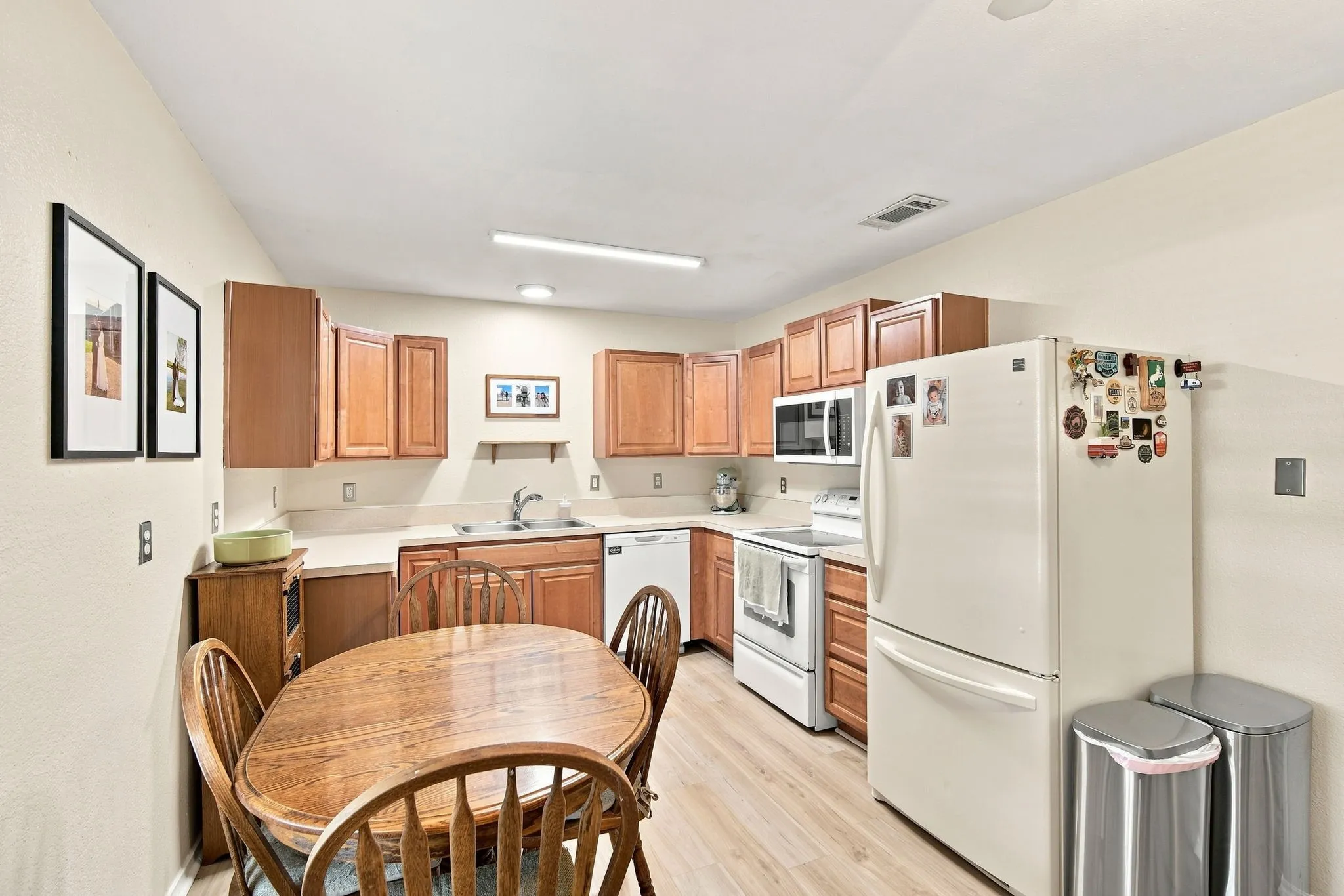 Functional U-shaped kitchen offering abundant cabinet storage, a wonderful space to cook and gather.