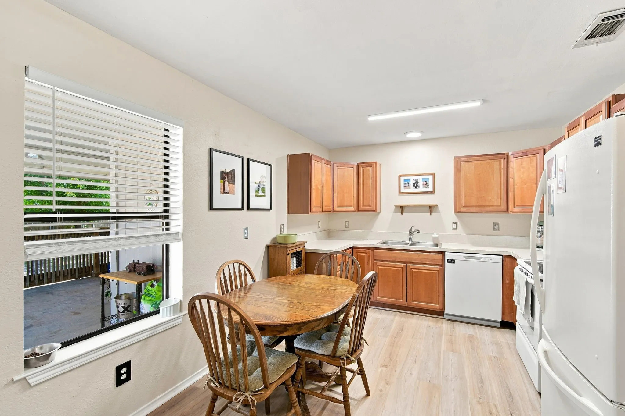 Well-appointed kitchen with wood cabinetry, a breakfast nook, and generous counter space for the home chef.