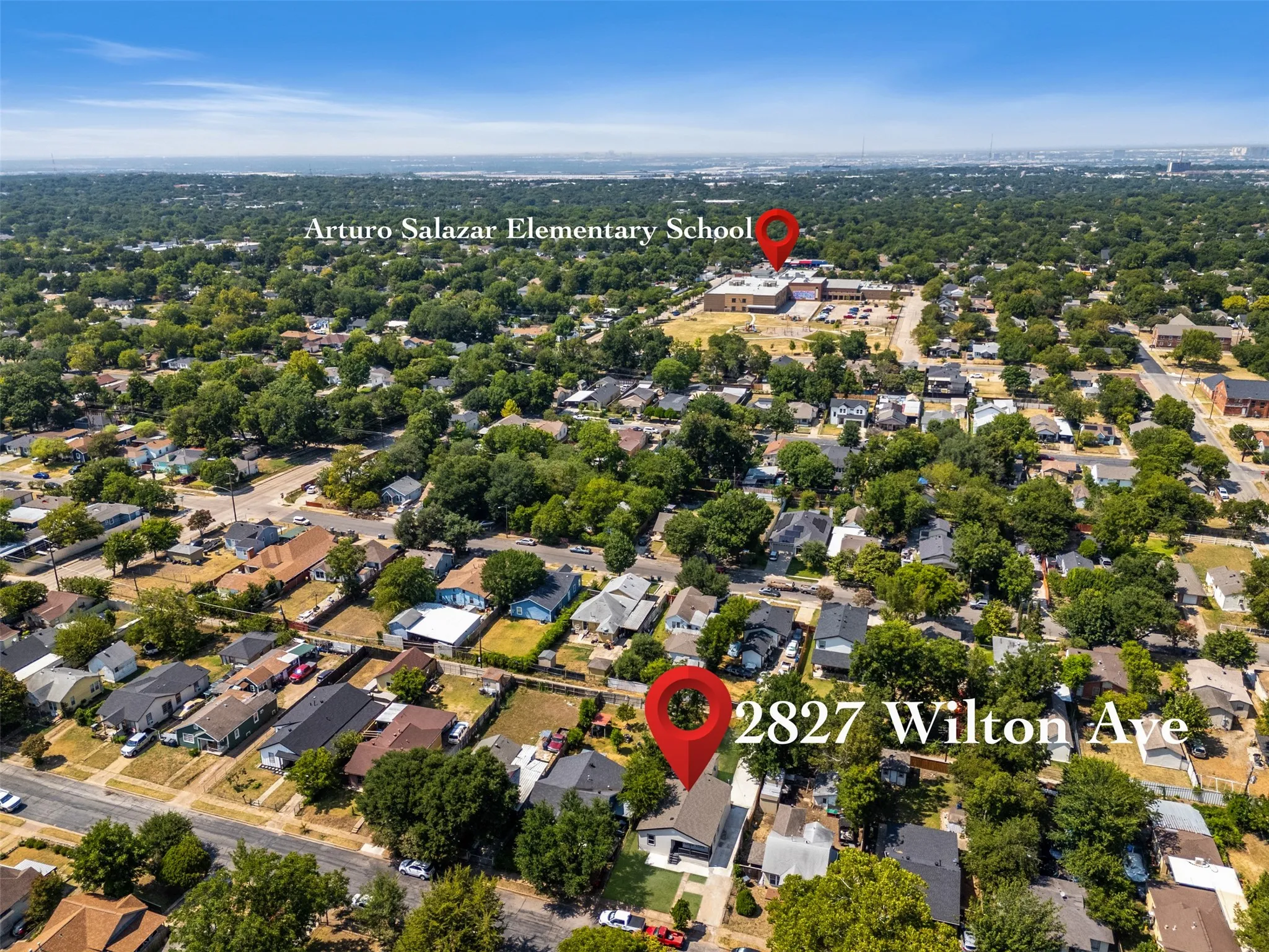 Aerial perspective of 2827 Wilton Ave showcasing the property's prominent corner lot position within an established, tree-lined neighborhood