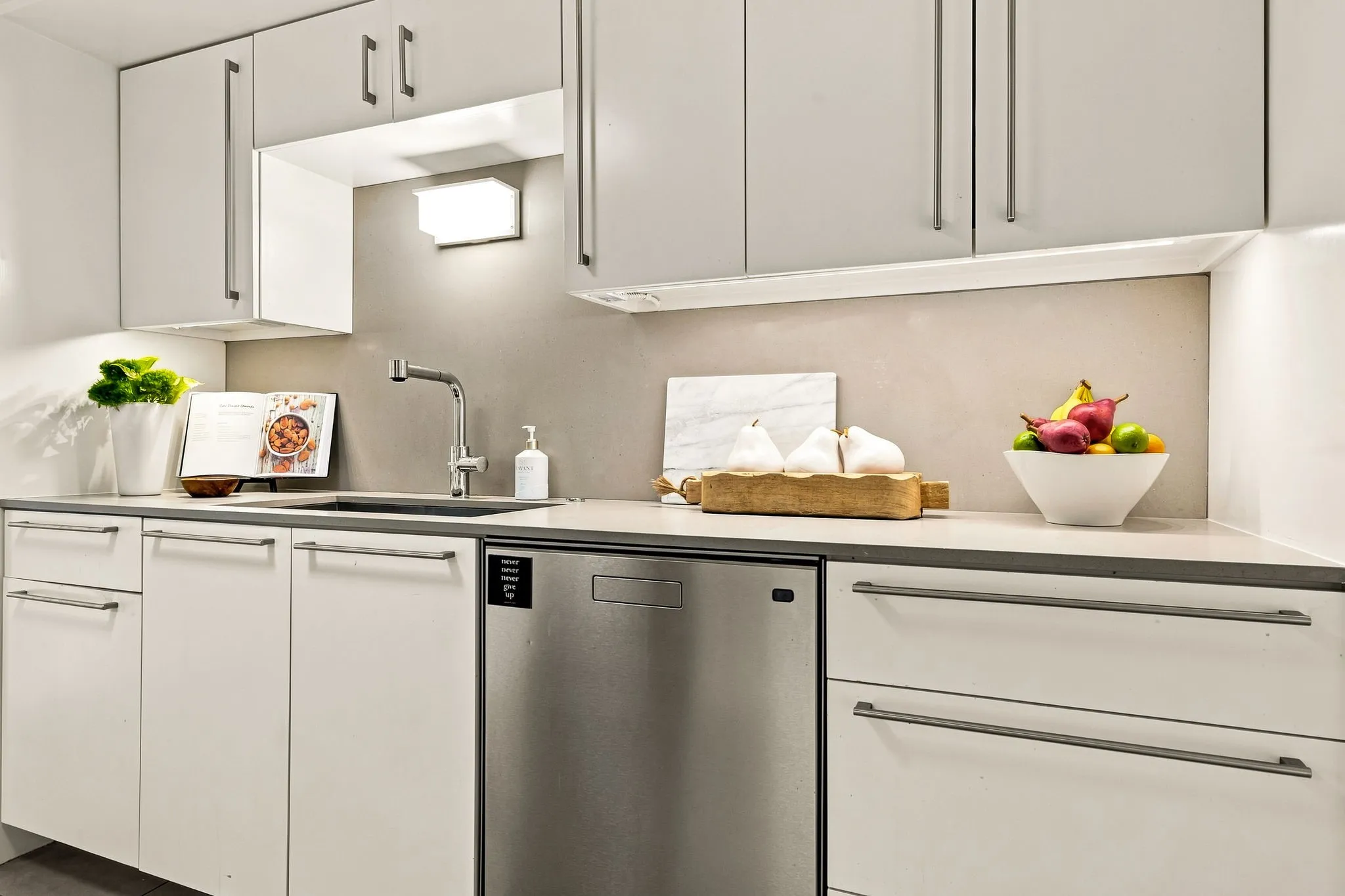 Recycle/trash pull-out is just one of many features, including soft-close cabinetry.
